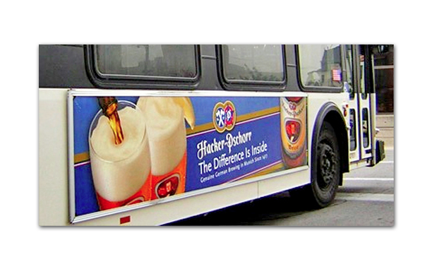 IMPORTED BEER RE-BRANDING TRANSIT AD