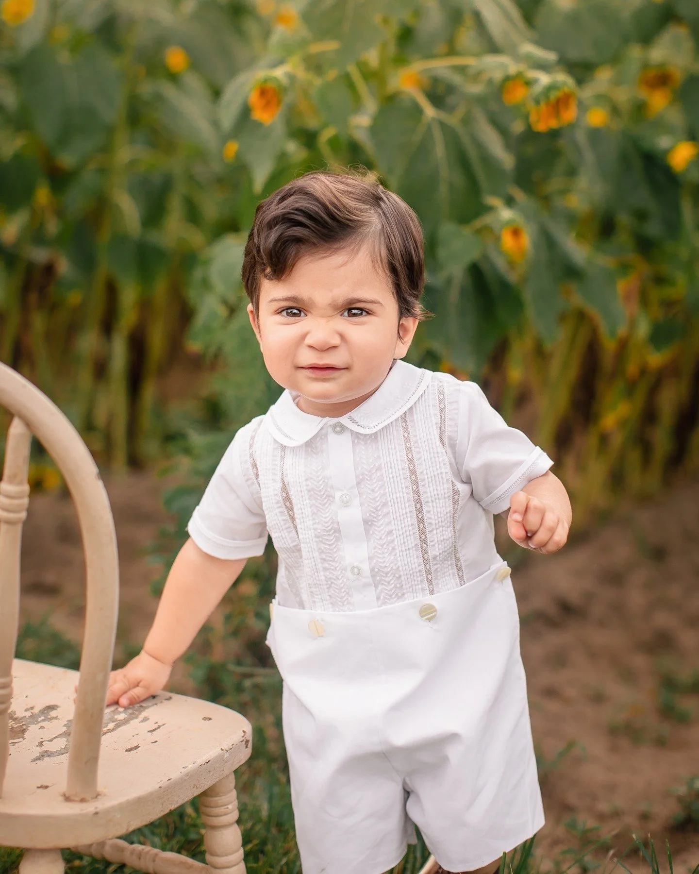 When you learn a really fun new scrunchy face right before your sunflower session. 😆😂 I love toddlers with all that big personality stuffed into such tiny humans.