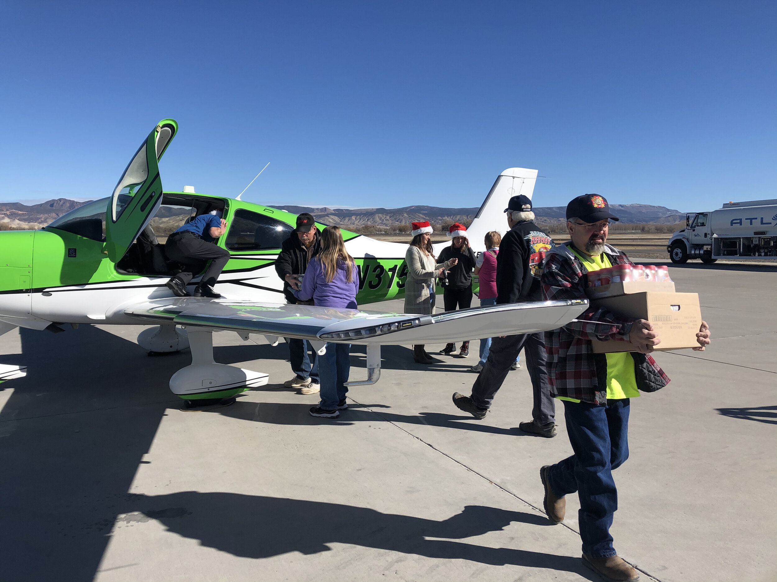 IA Instructors Kiley Lynch, Stephen Slade, Ricky Burton and IA Member Karen Seaton volunteer to fly almost 700lbs of toys and food to Montrose, CO veterans in need for the VFW/CABA annual airlift.