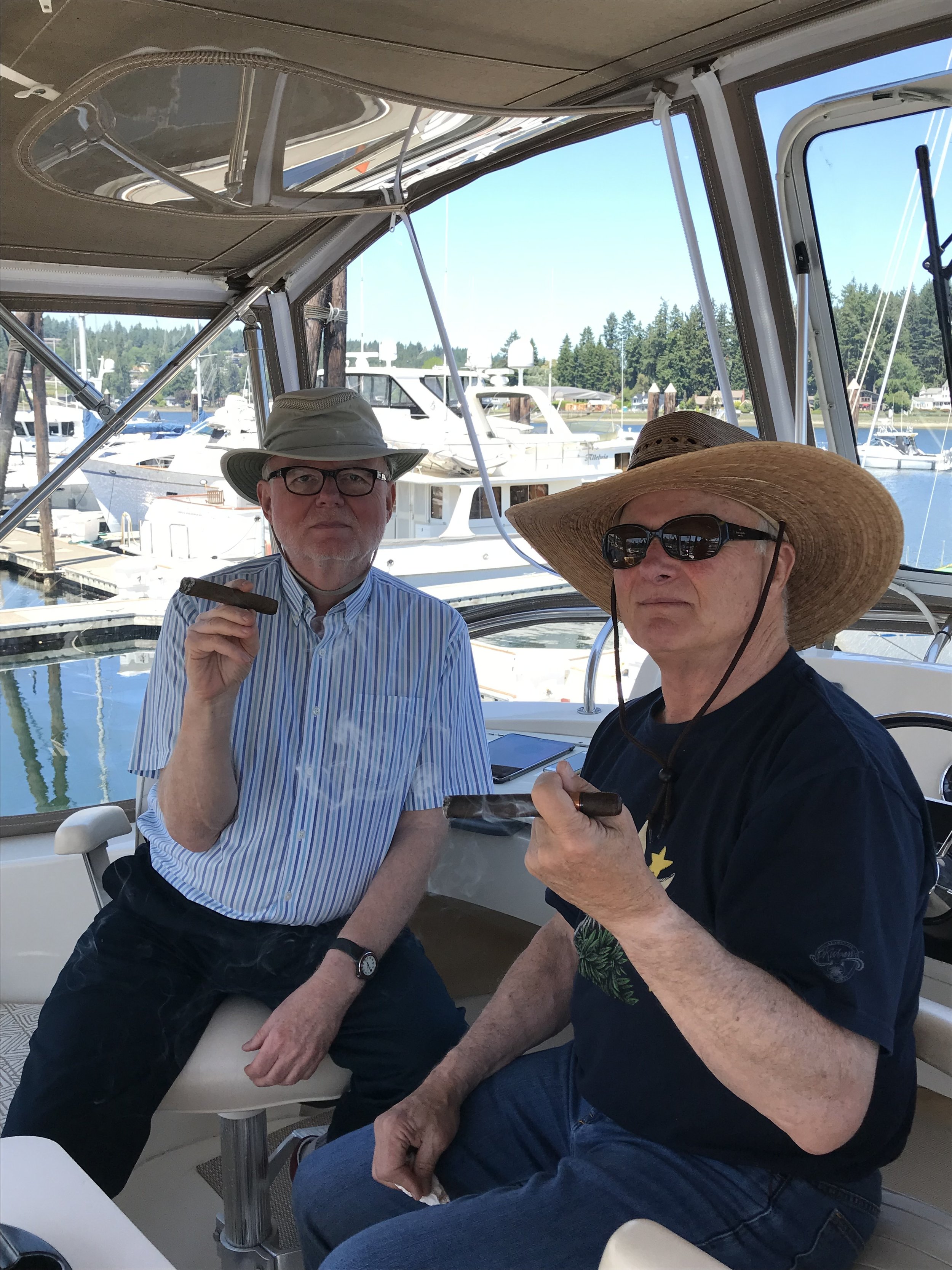 Harlen Whitling and John Simpson enjoying cigars on Red Knot.jpg