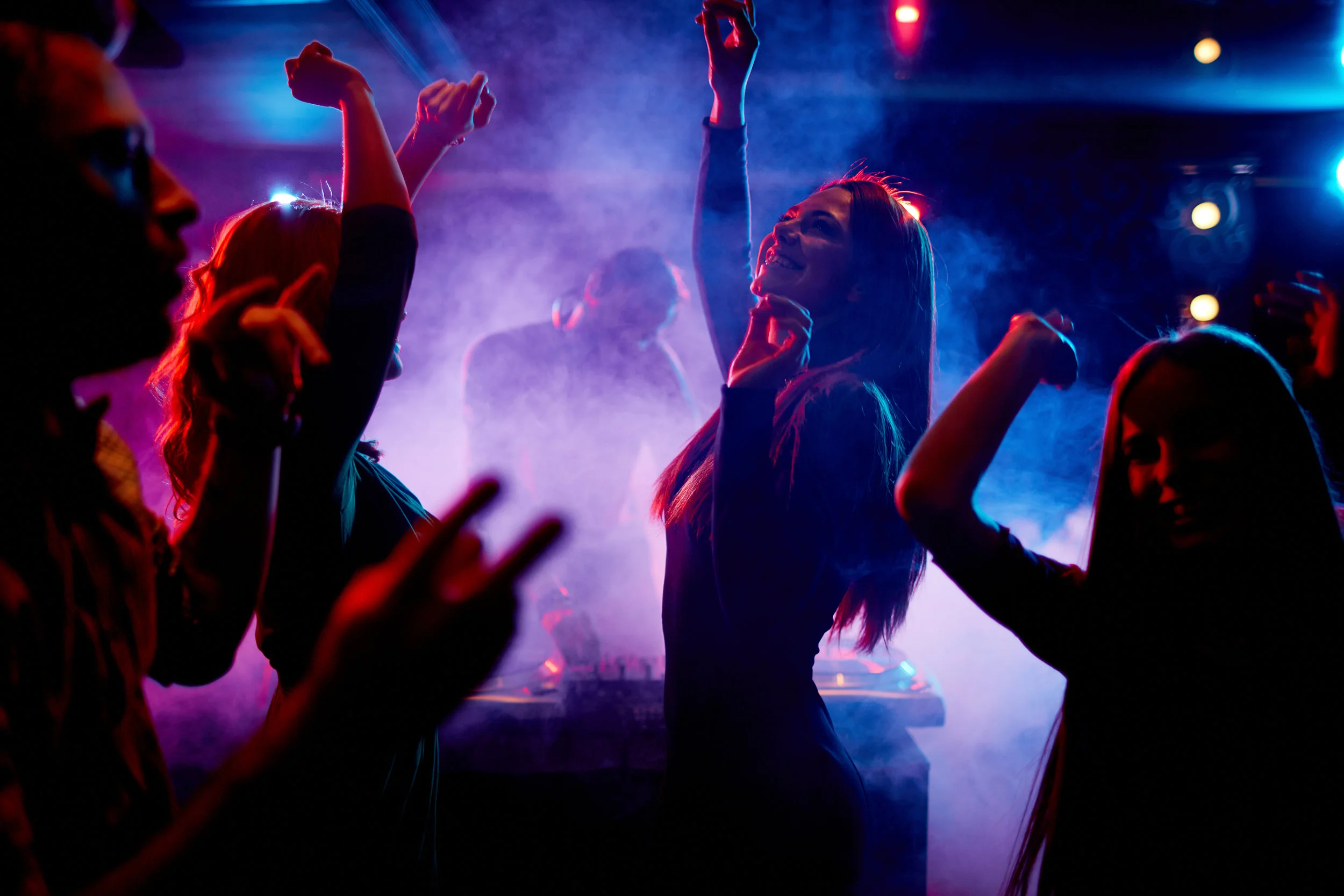 Group-of-dancing-young-people-enjoying-night-in-club.jpg