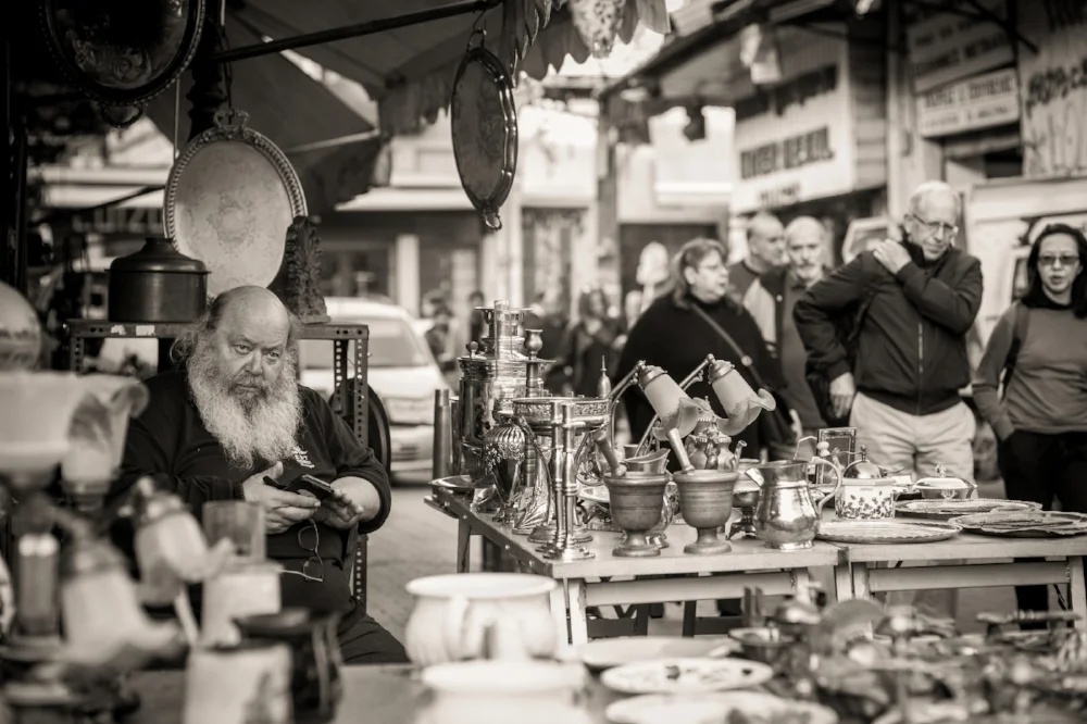 Flea market vendor, Monastiraki, Athens. Sony A9, Leica 75mm f1.4 Summilux