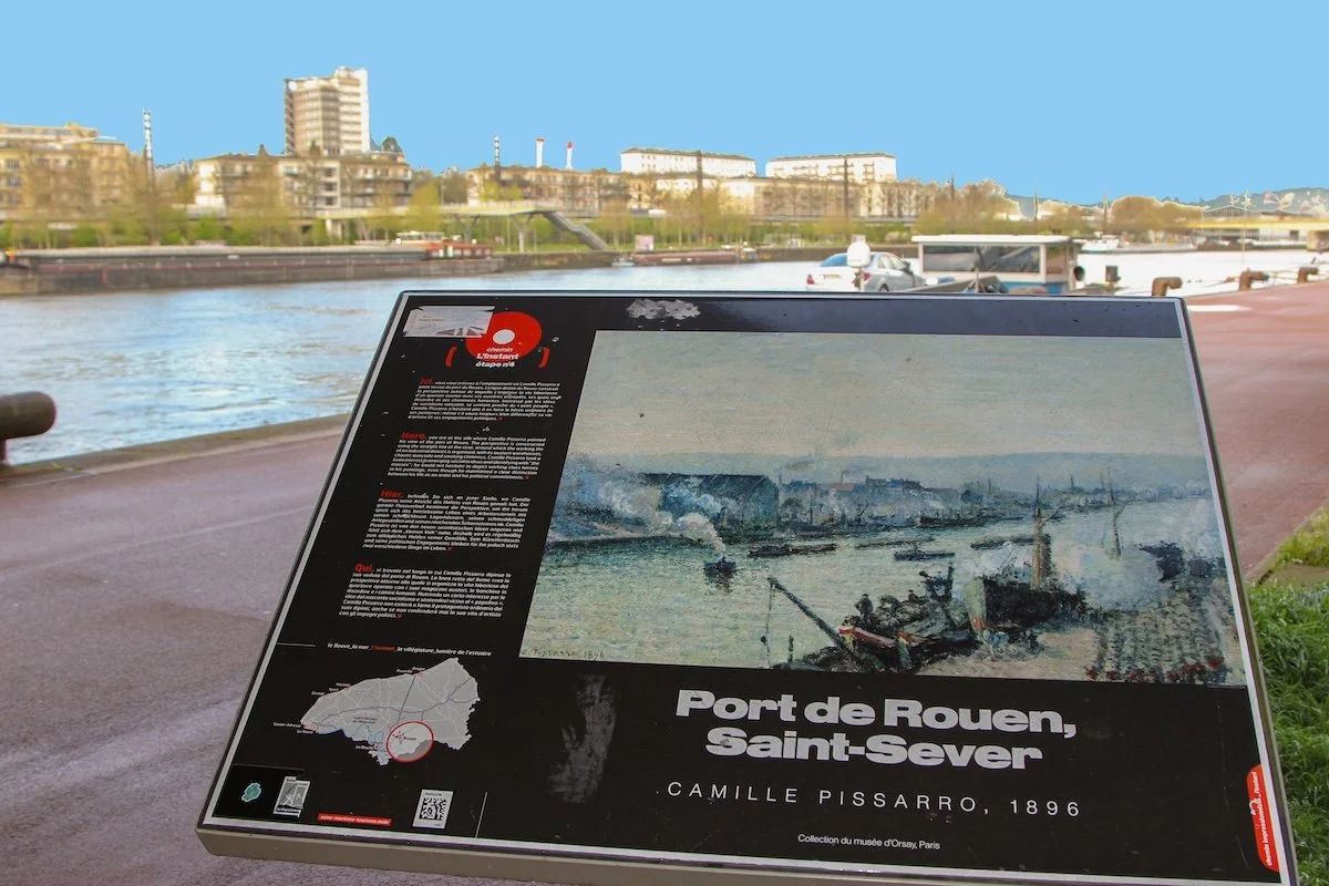 Panel with Impressionist painting of port and actual port in background