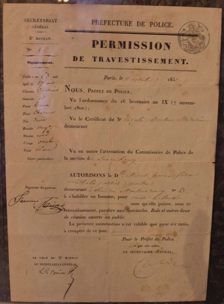 A yellowed paper with writing in French