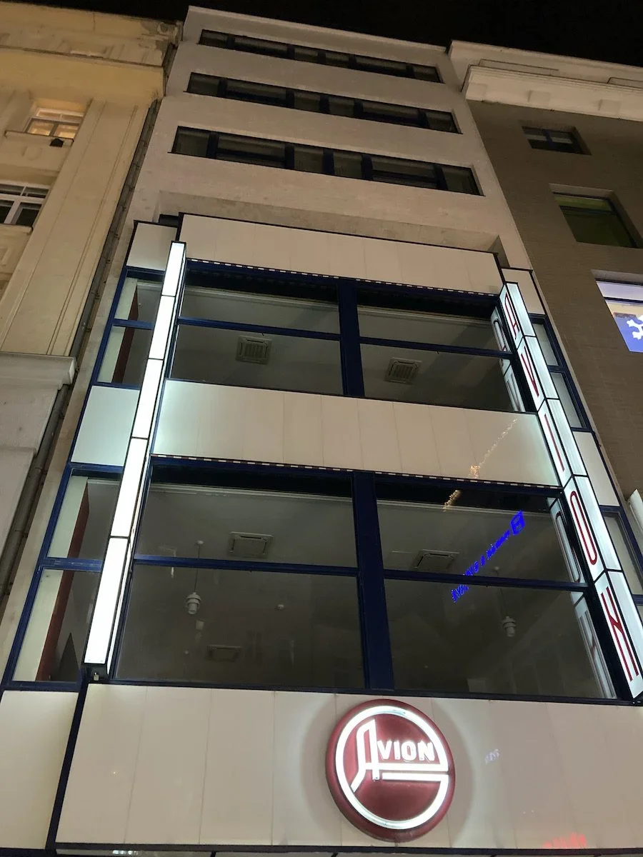 Looking up at modern white building