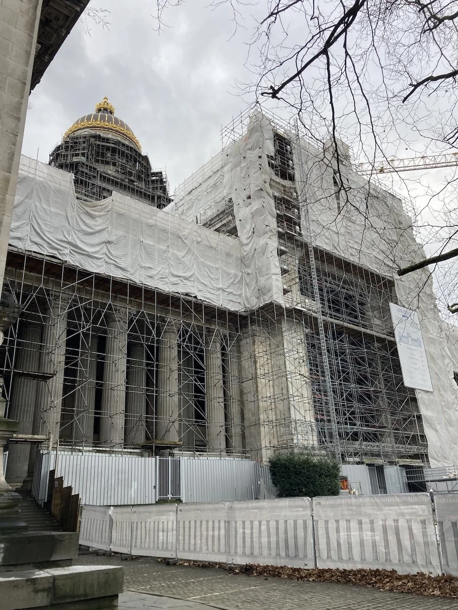 Scaffolding and plastic covered large 19th century building