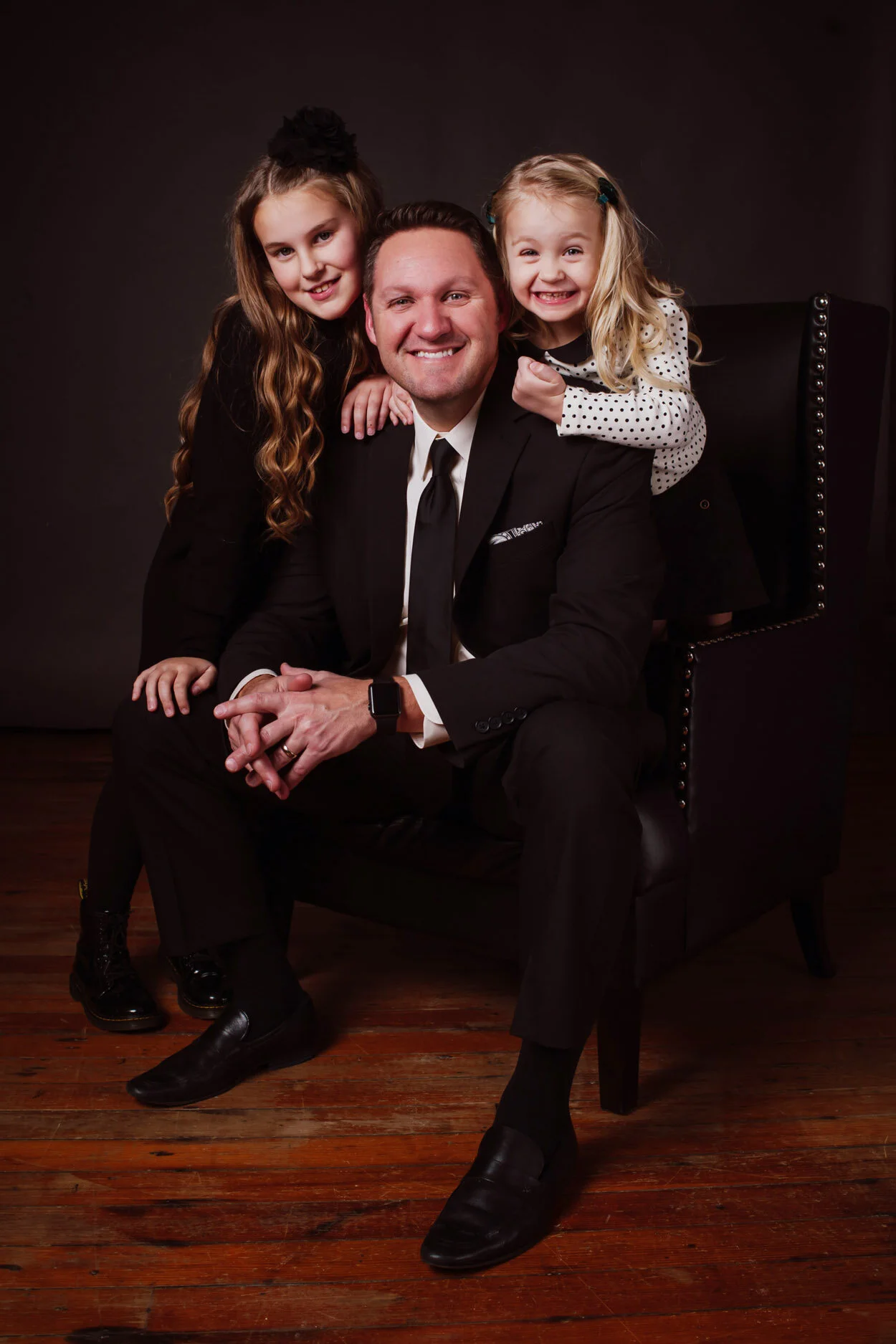 Surrounded by two lovely ladies, one a little more enthusiastic than the other.