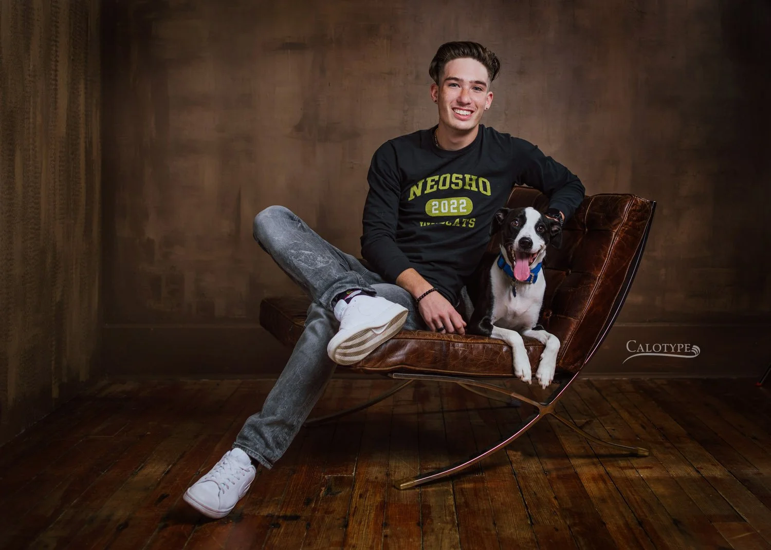 class of 2022 senior boy with his dog