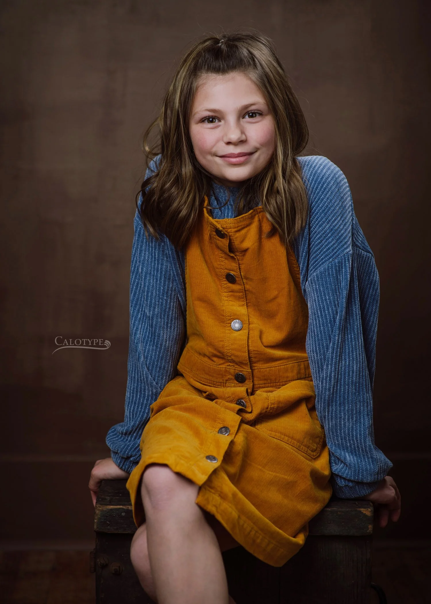 8 year old girl, smiling naturally and posing for a picture