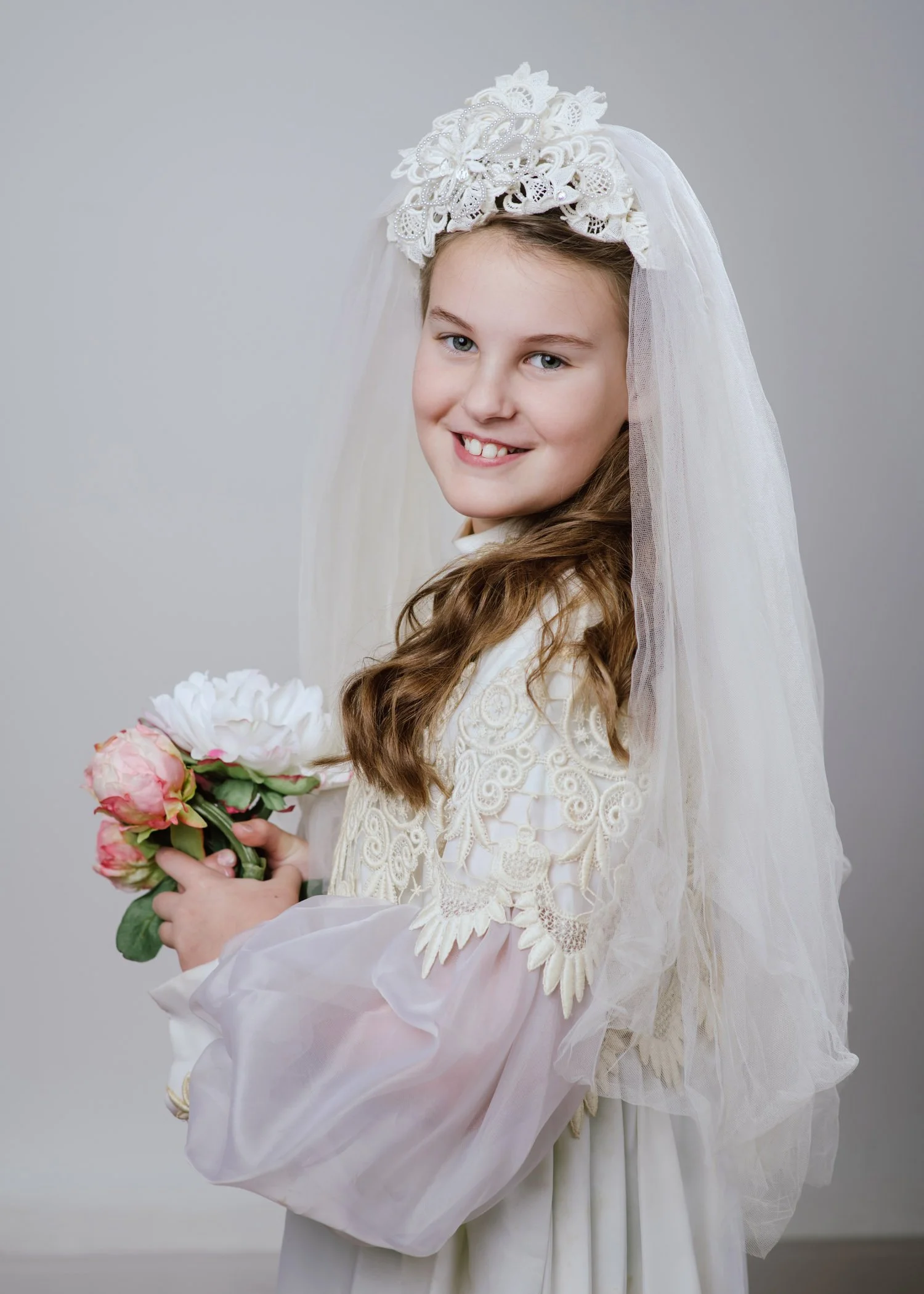 10 year old granddaughter dressed up in Grandma's wedding dress