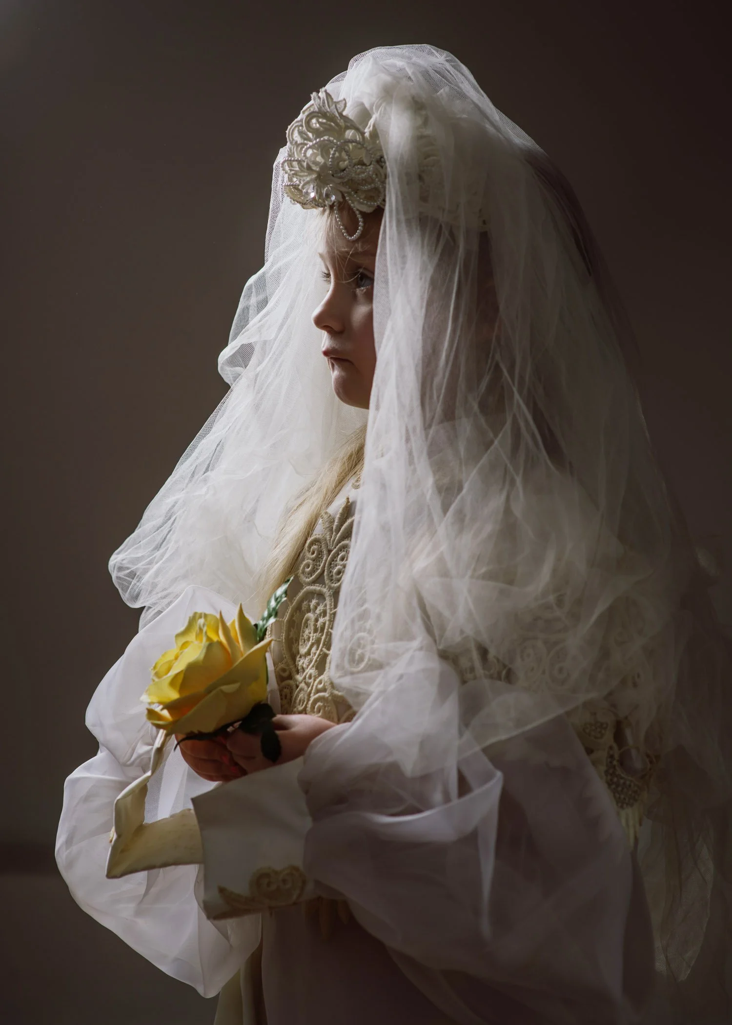 4 year old granddaughter dressed up in Grandma's wedding dress
