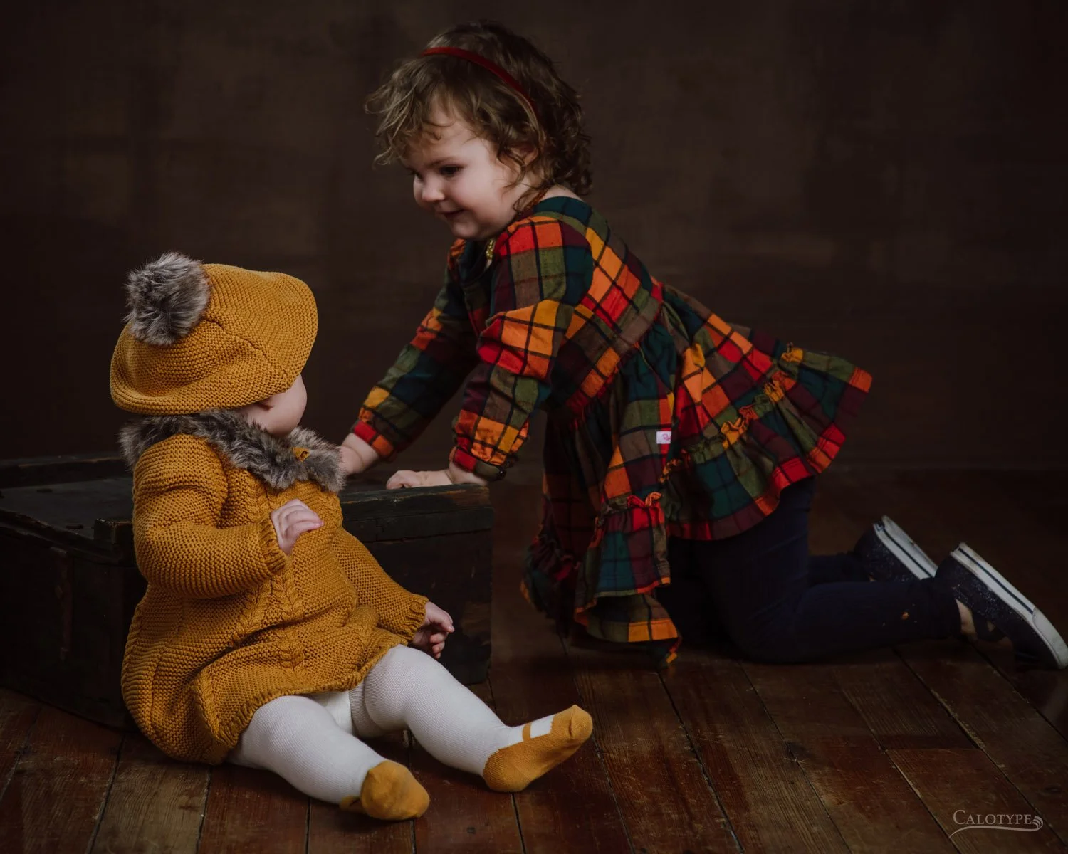Two little girls playing in a photography studio