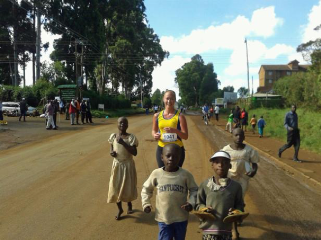 Still my favorite running picture ever: running in the Kass Marathon just like I run here everyday -- me working hard and surrounded by barefooted children easily keeping pace.