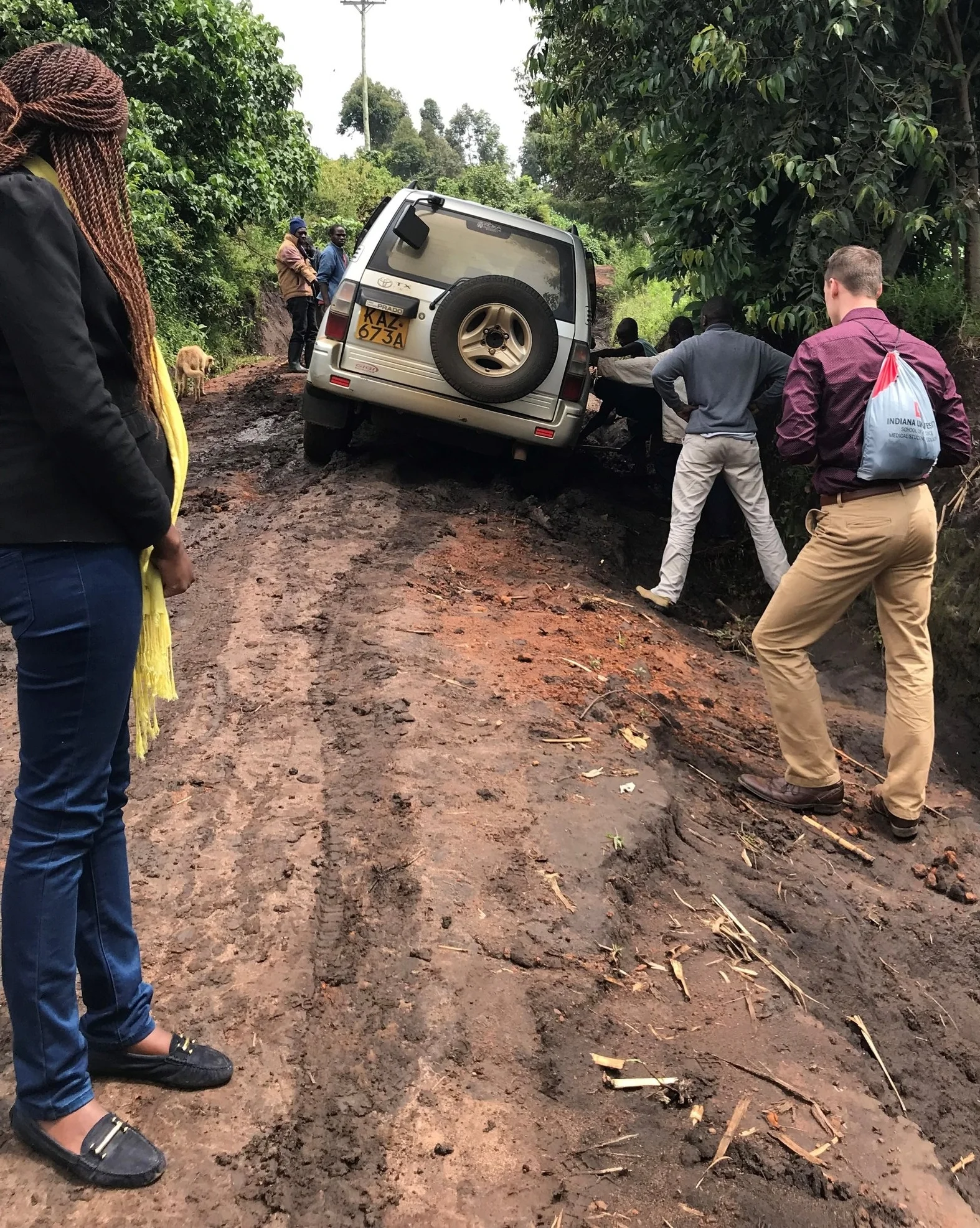 The villagers helping us dig our car out.