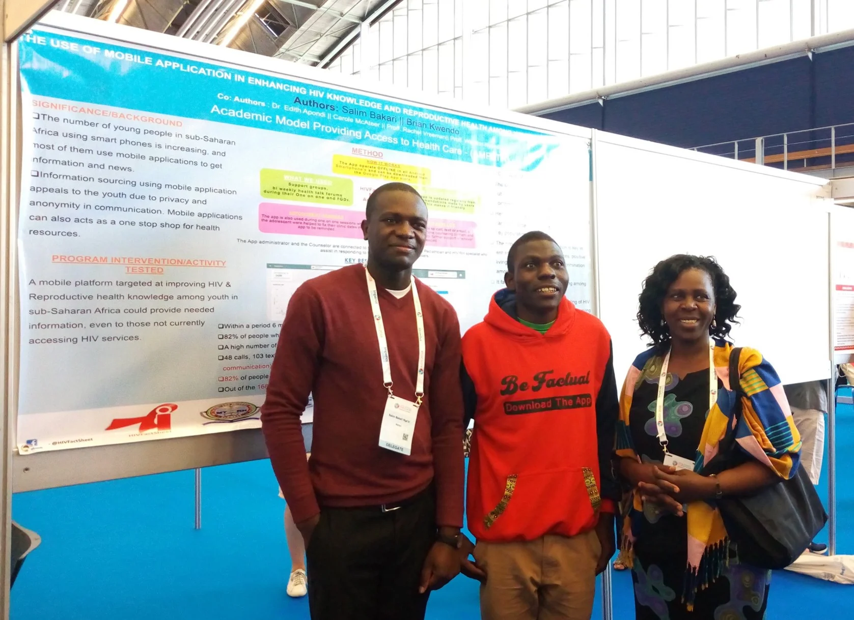 Salim Bakari (left) and Brian Kwendo (center) presenting at AIDS 2018.