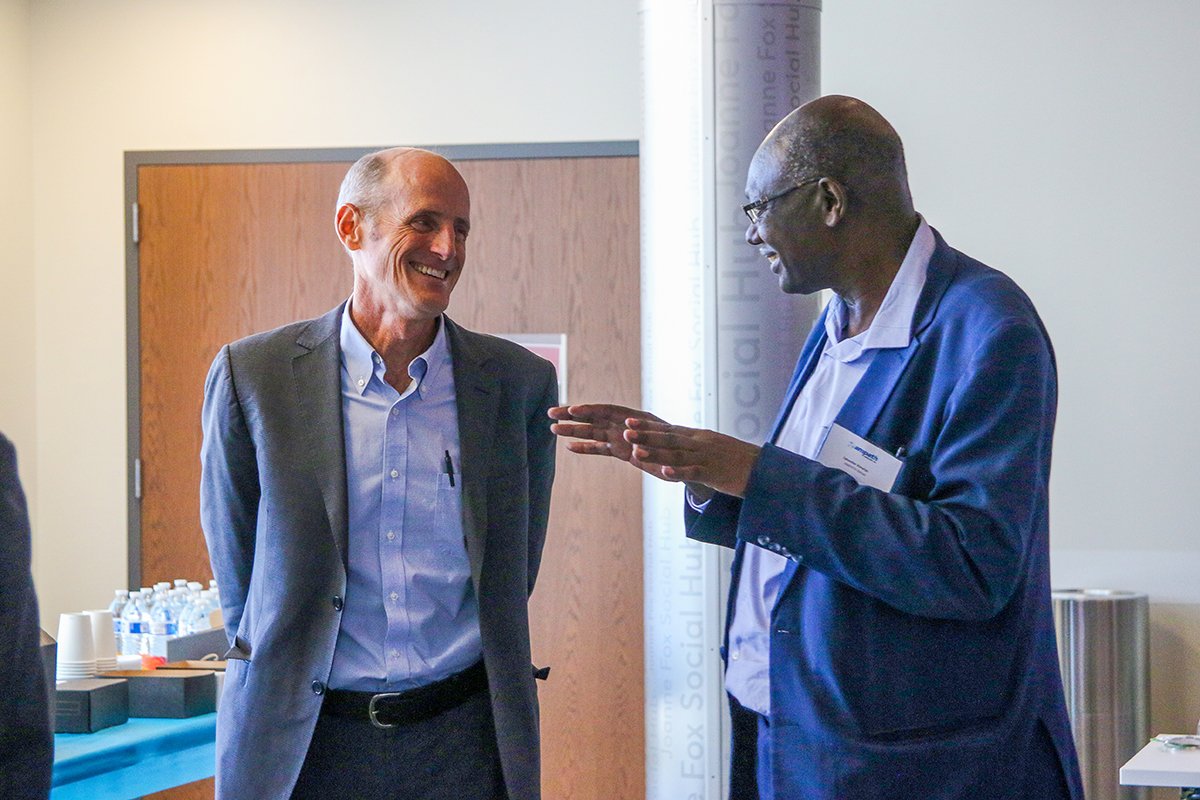  Dr. Tim Evans and Professor Sylvester Kimaiyo catch up before the meeting about Universal Health Coverage (UHC). 