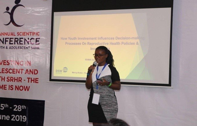  A student sharing a presentation during the 3rd annual conference of the reproductive health network Kenya in 2019. 