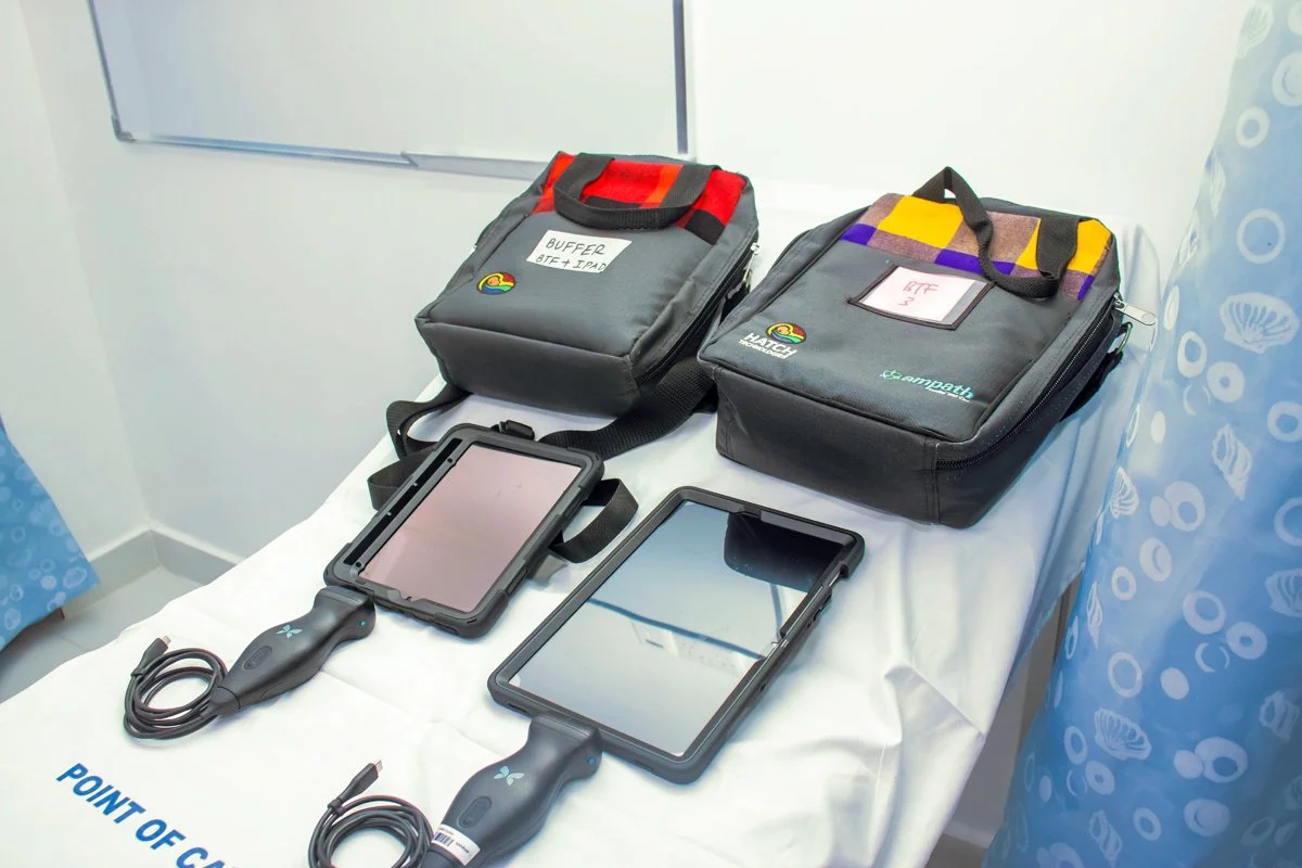Two POCUS machines sitting on a bed