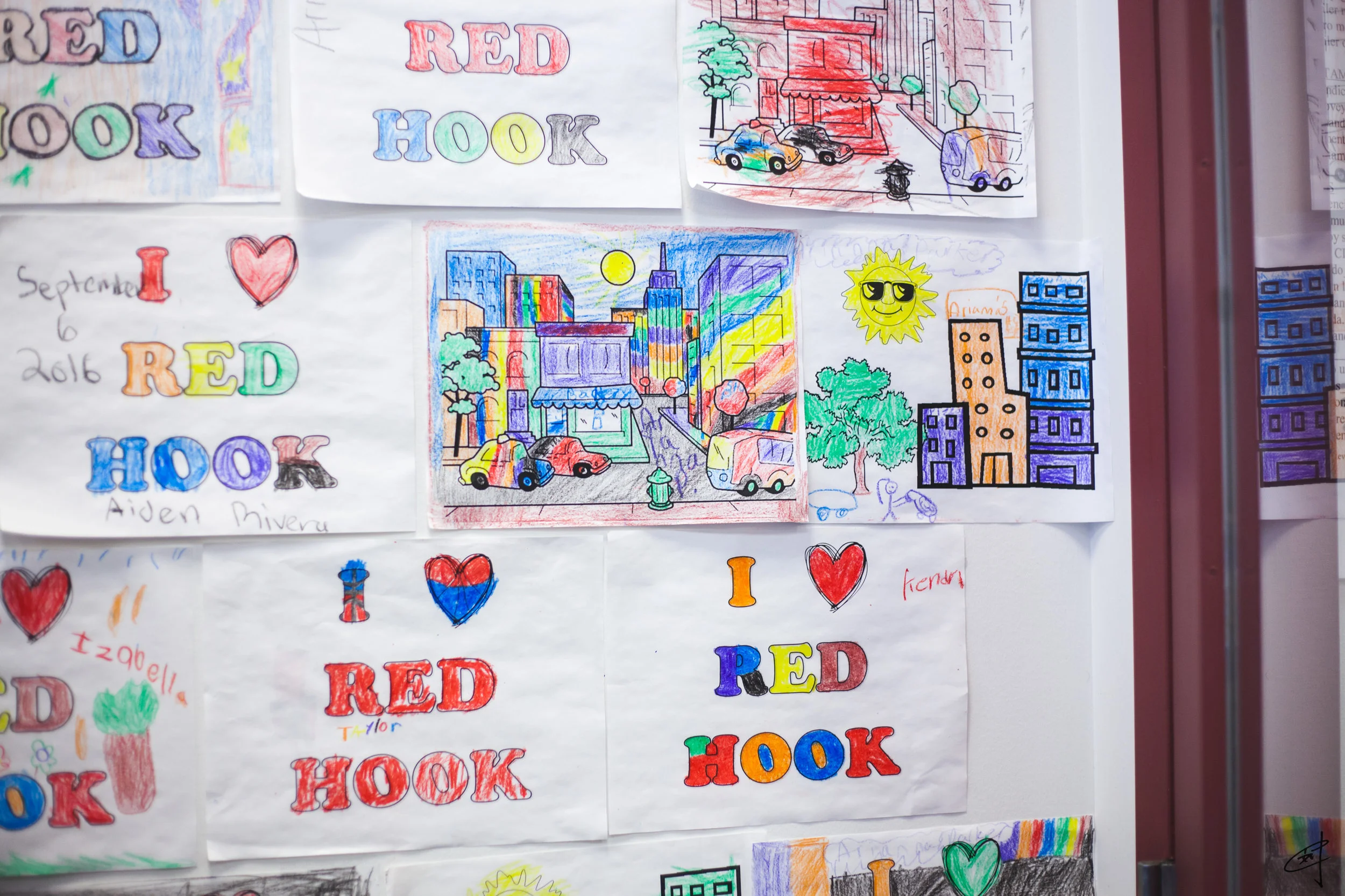 “I Love Red Hook” colorings cover an entire wall at the court’s Housing Resource Center.