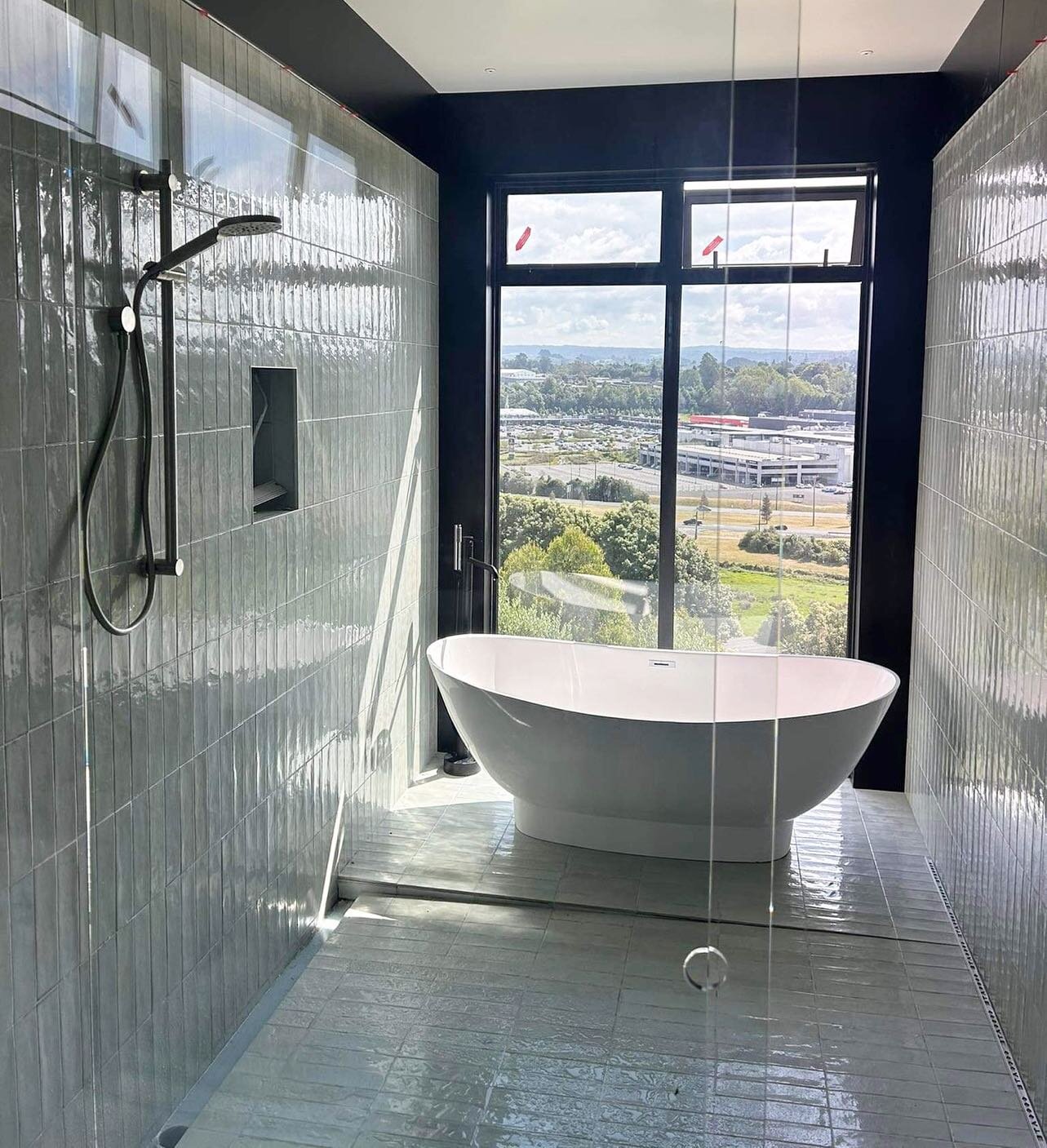 Always love a bath with a view! Plumbing for this new house is near completion.