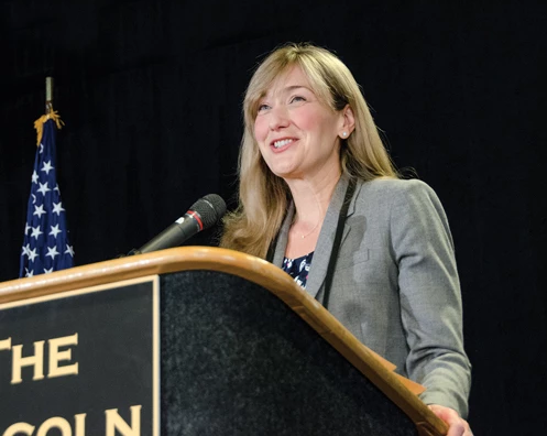 Caroline at Podium.png