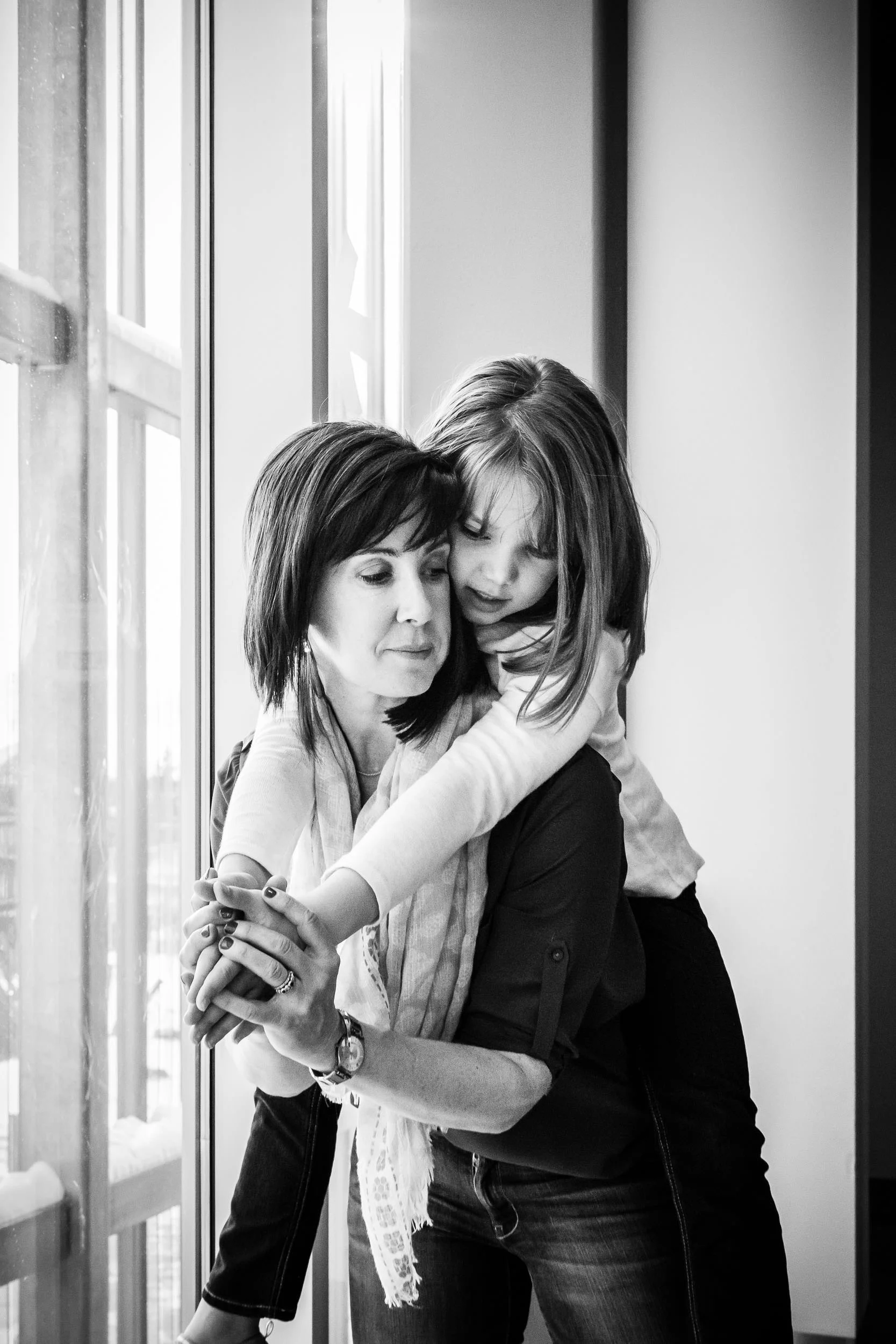 monochrome_image_of_mother_and_daughter_in_piggyback_by_Hunnicutt_Photography.jpg