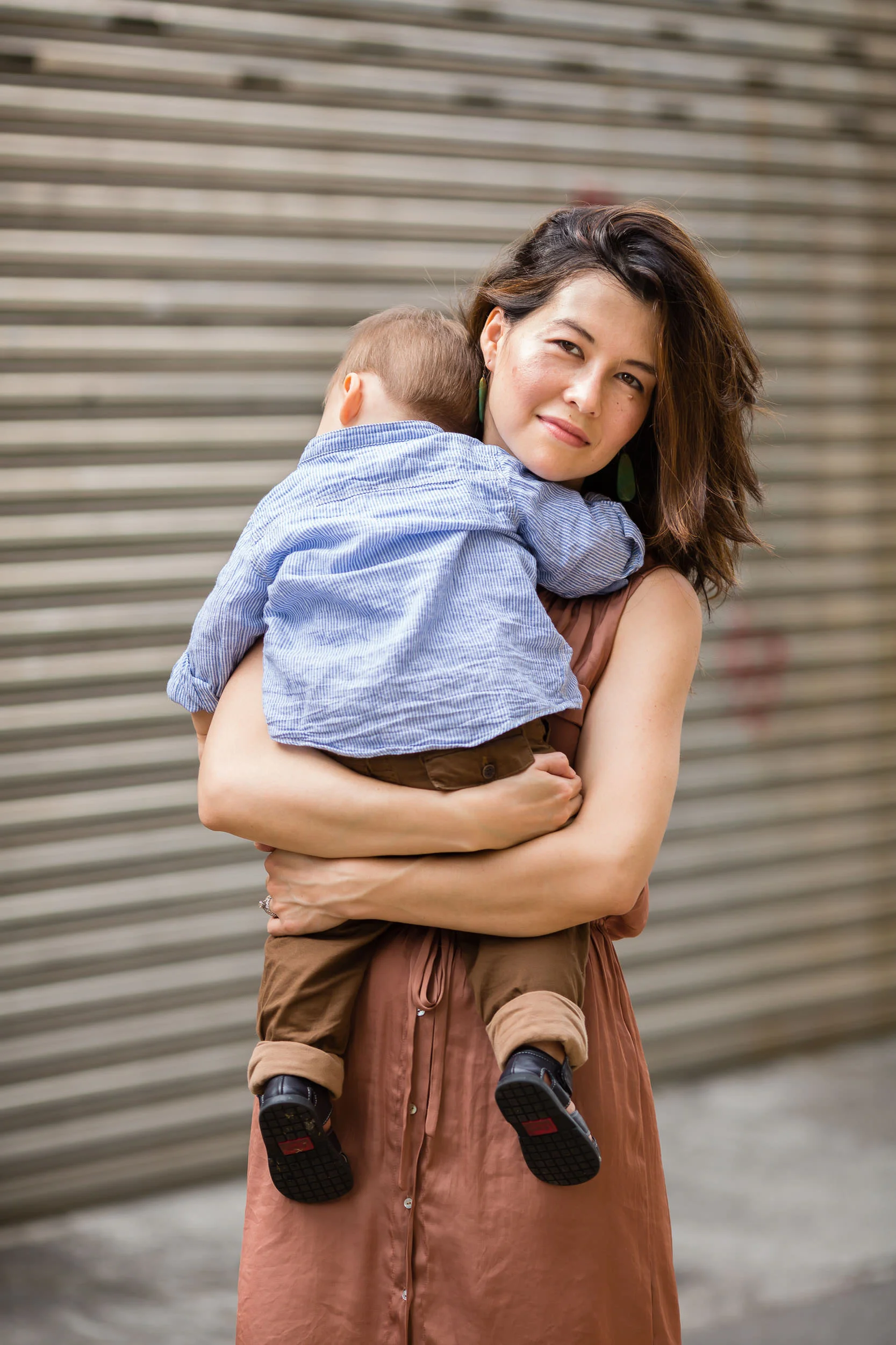 mother_holding_son_in_the_city_by_Hunnicutt_Photography.jpg