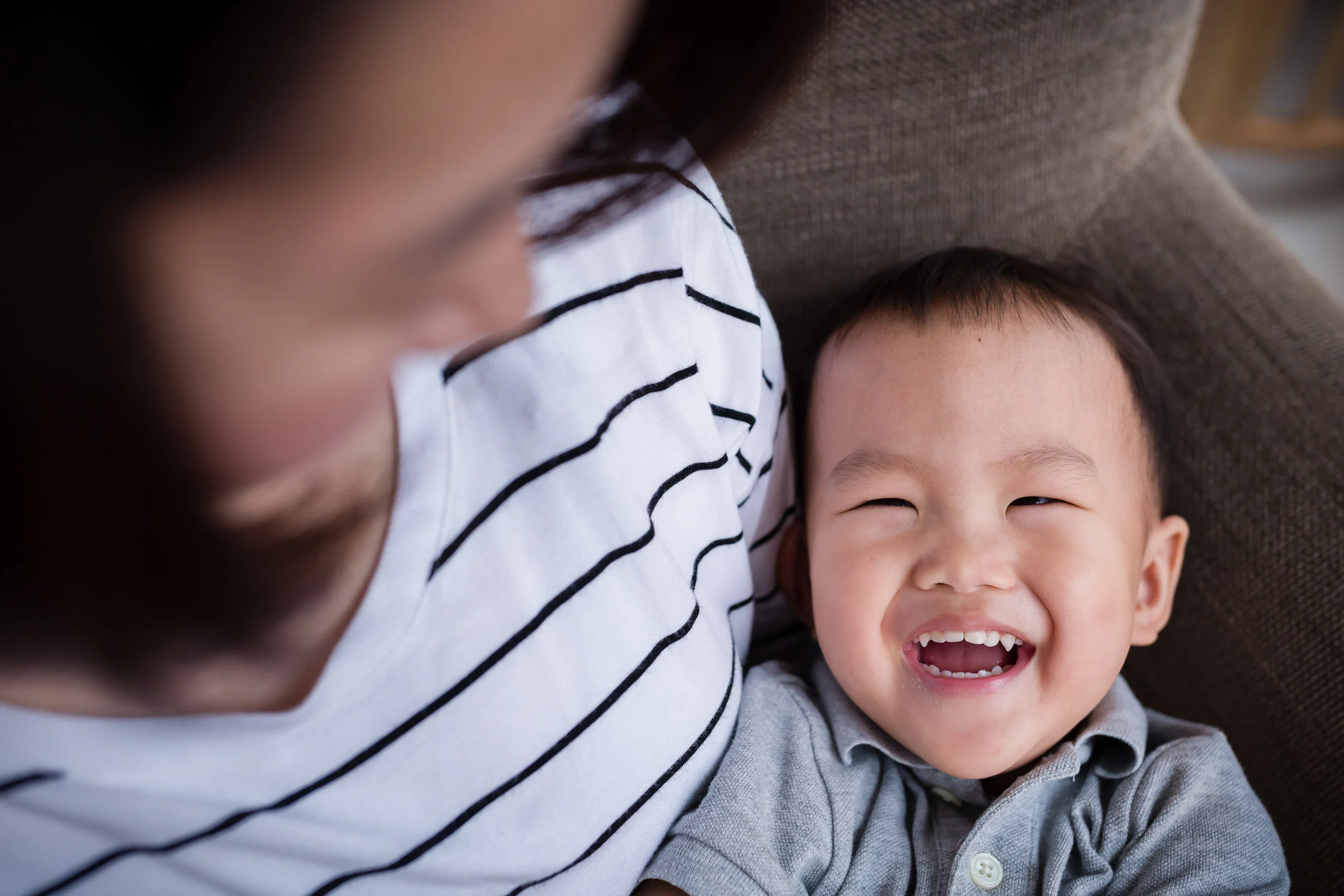 young_bou_laughs_while_in_mothers_lap_by_Hunnicutt_Photography.jpg