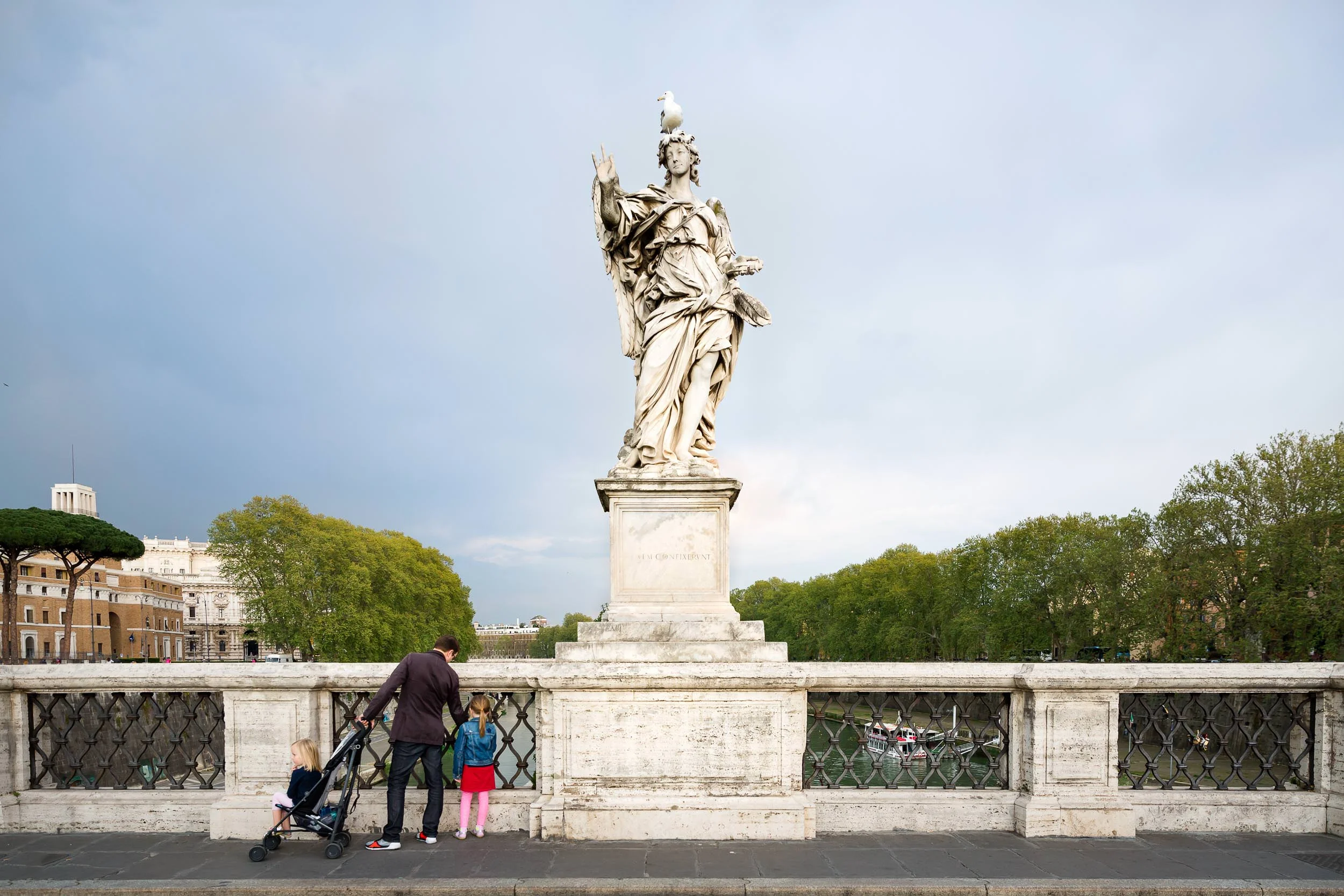 dad_and_daughters_looking_at_the_river_in_rome_Personal_portfolio_by_rebecca_hunnicutt_farren.jpg