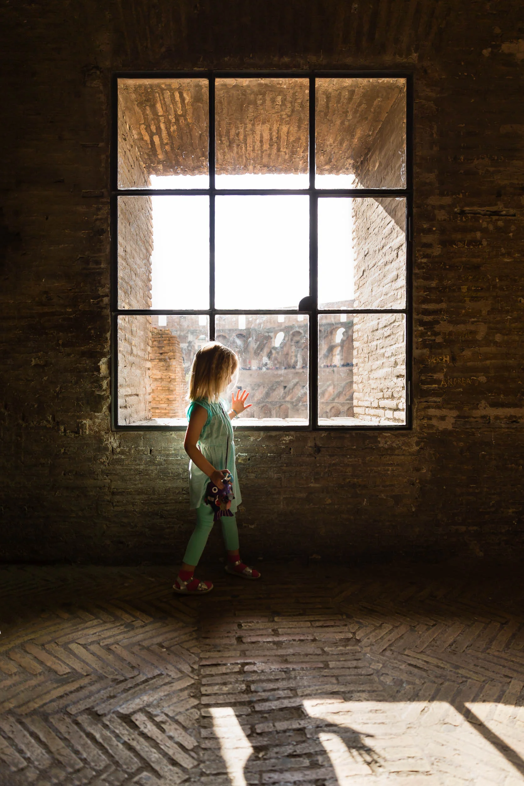 girl_in_teal_exploring_within_the_roman_colosseum_in_Personal_portfolio_by_rebecca_hunnicutt_farren.jpg