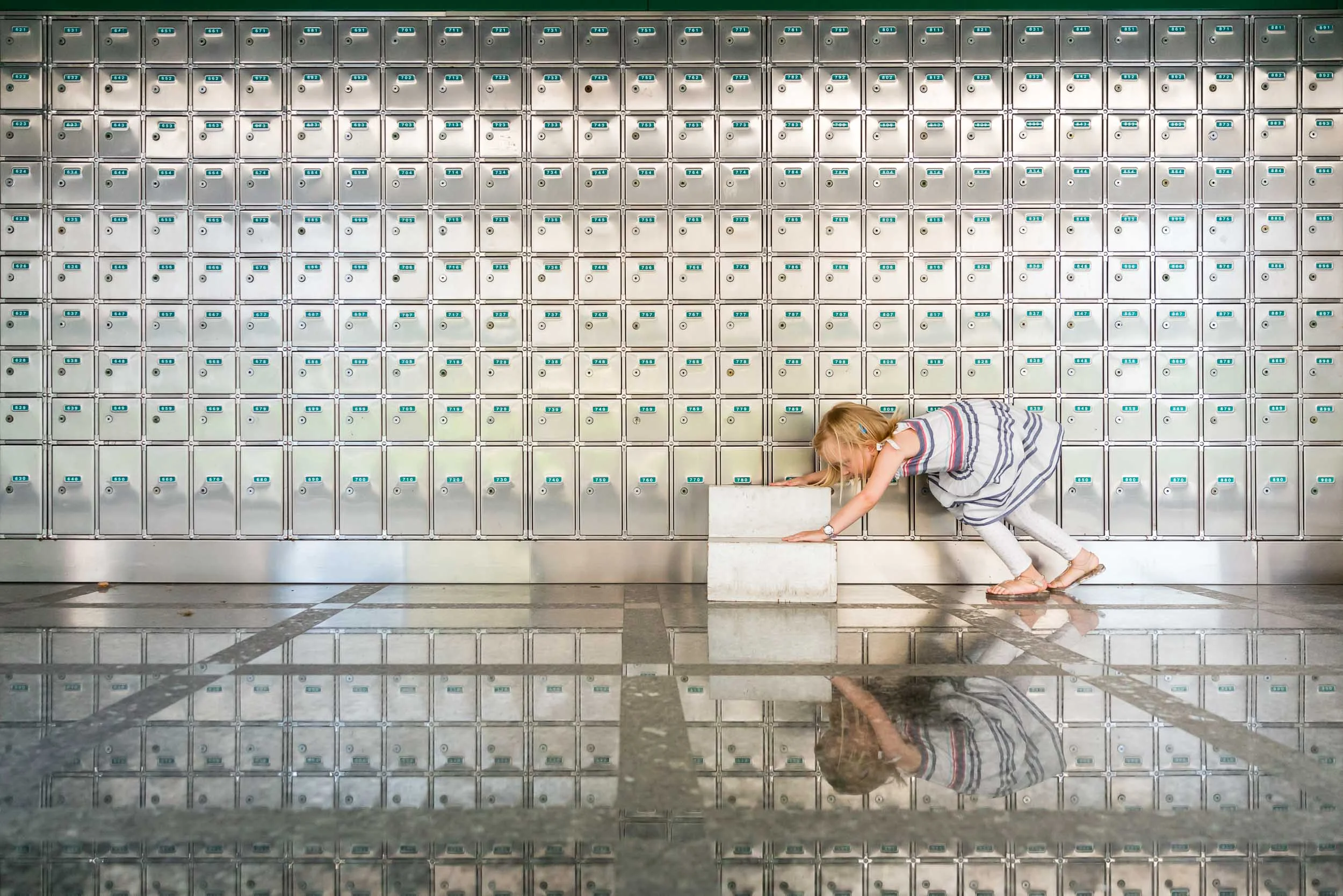 image_of_girl_pushing_steps_at_postoffice_with_reflection_in_Personal_portfolio_by_rebecca_hunnicutt_farren.jpg