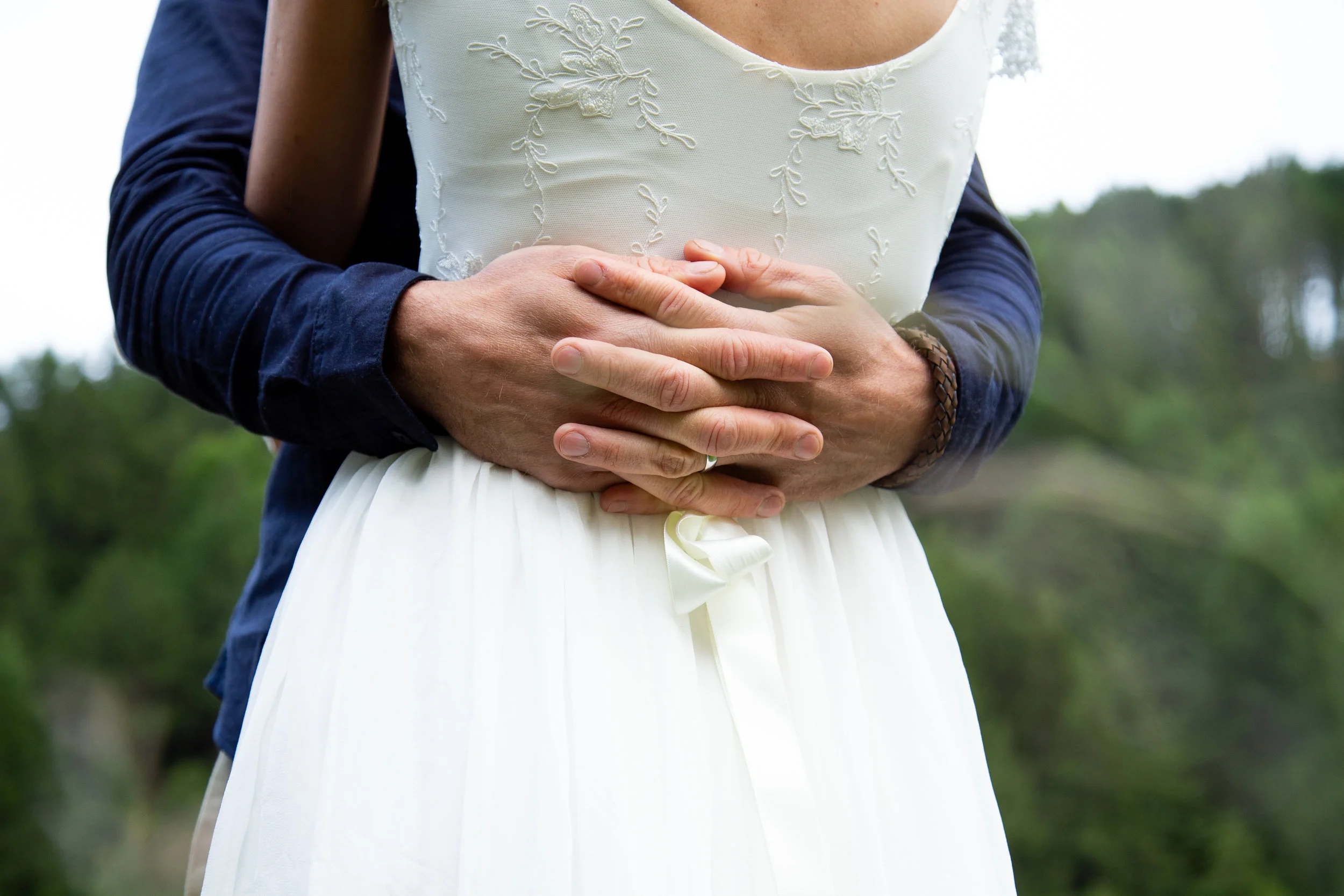 Bride &amp; Groom hug on wedding day