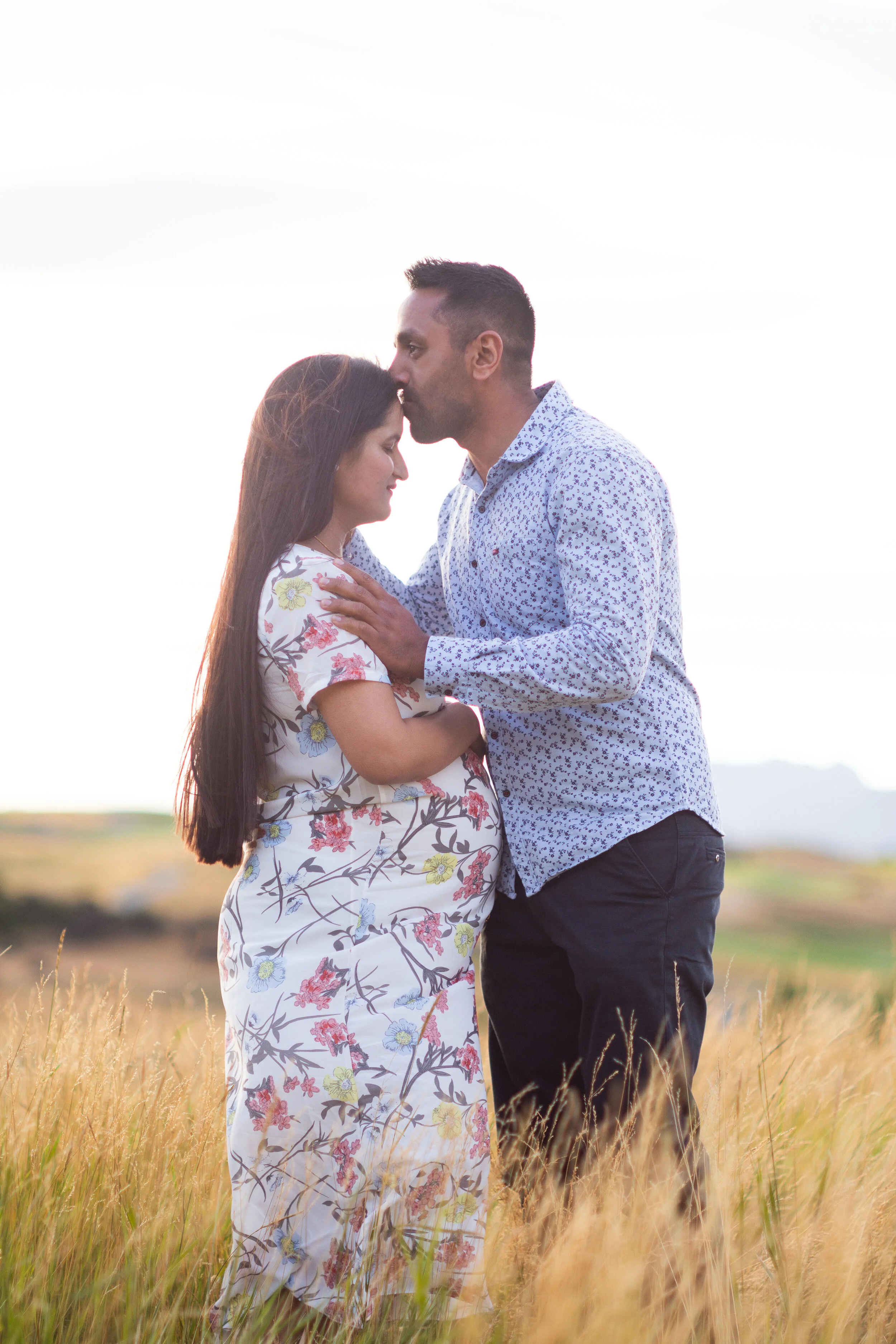 Expectant parents kiss