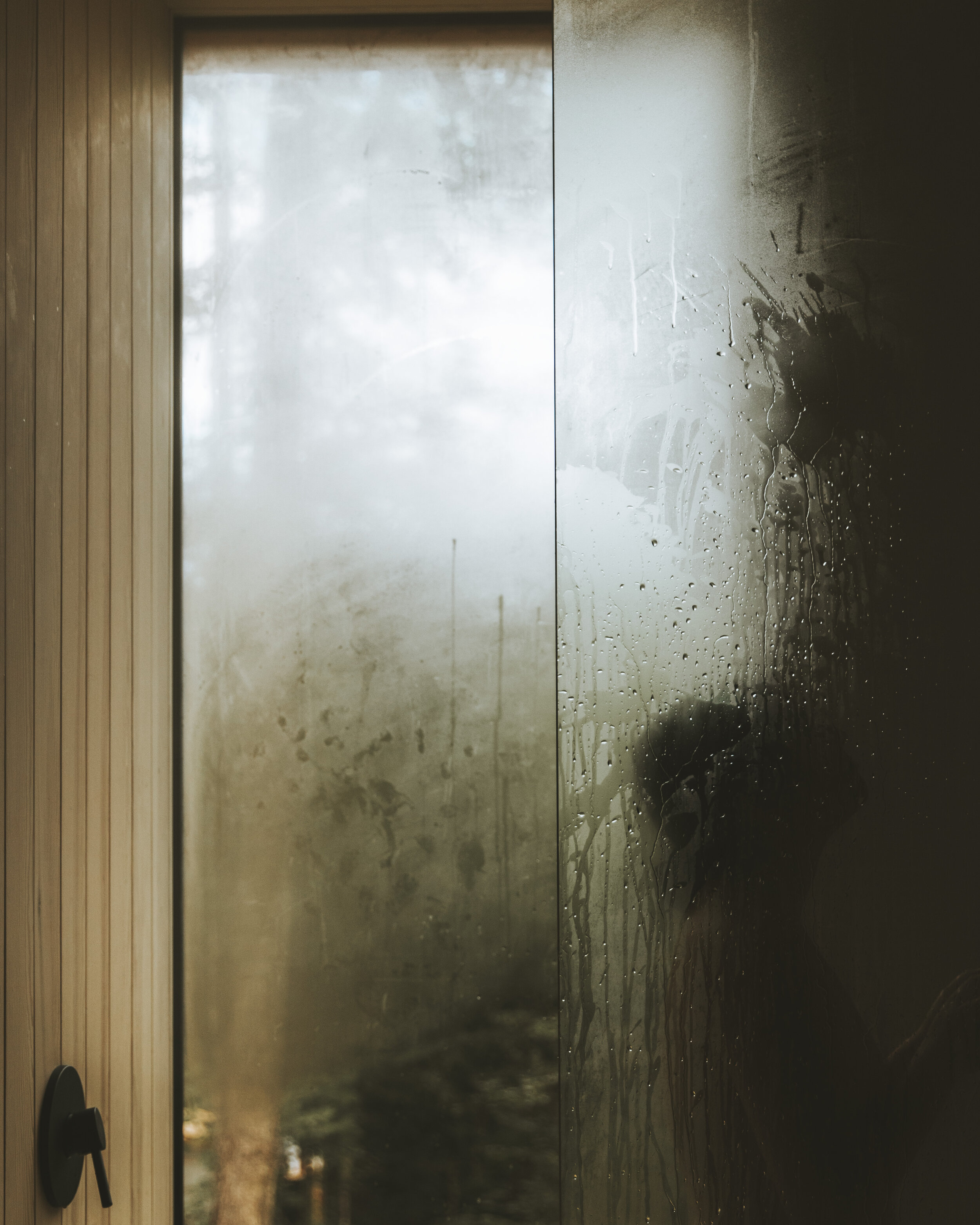 Steamy shower at Hinterhouse. Floor to ceiling windows.