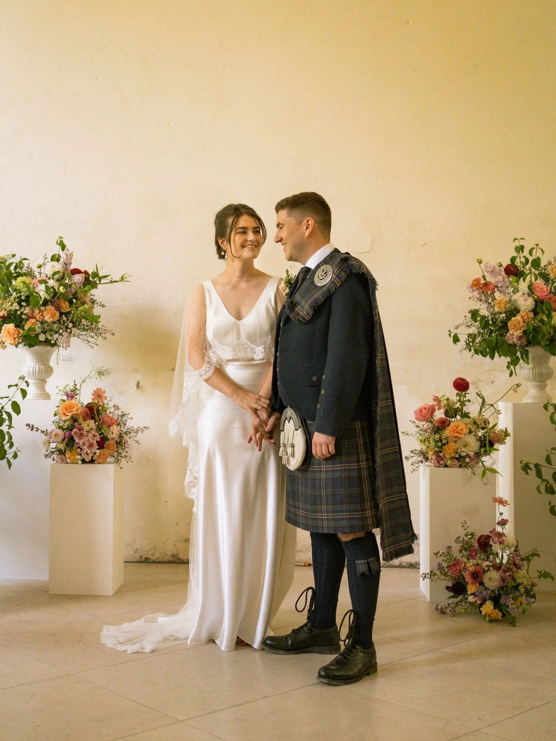 Sooo many stunning weddings to share - I am very behind and need to catch up! 
Here&rsquo;s a gorgeous preview of the lovely Esther in her Lily gown and lace hem cape veil, flanked by the dreamiest blooms by @studioblosm 
Captured beautifully by @eml