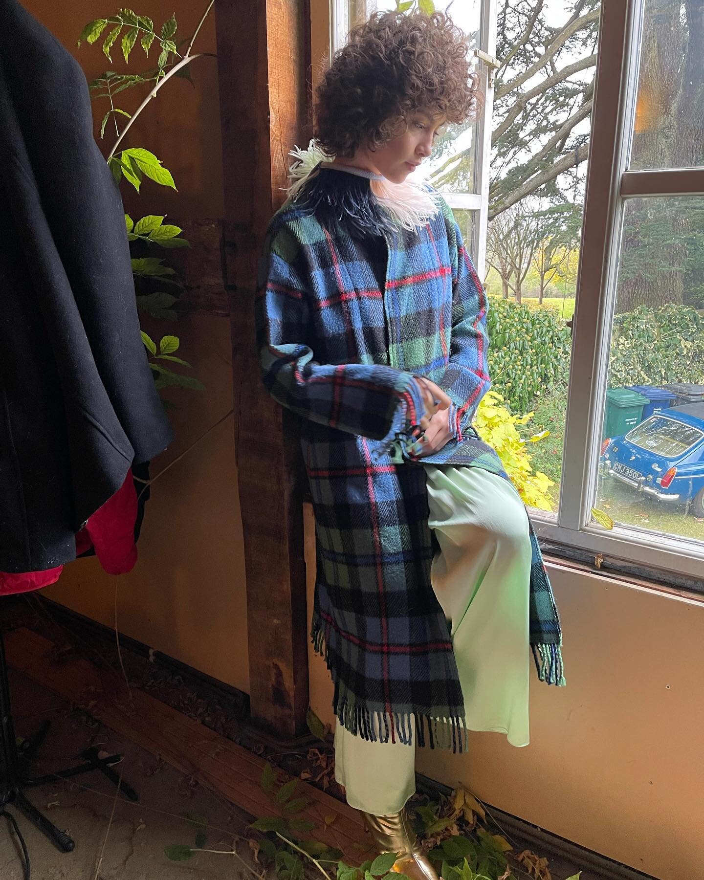An outtake from our photoshoot last week of beautiful @bibirojass amongst the wisteria, top to (nearly) toe in Grace Wears&hellip;silk Pistachio Palazzos, a Blanket Coat and a little Feathery Collar! My dream winter outfit! #gracewears #blanketcoat #