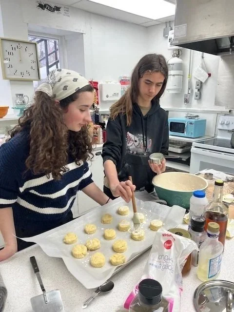 Samantha teaching Marcus how to make Deacon Deb's grandmothers scones on our last snow day.