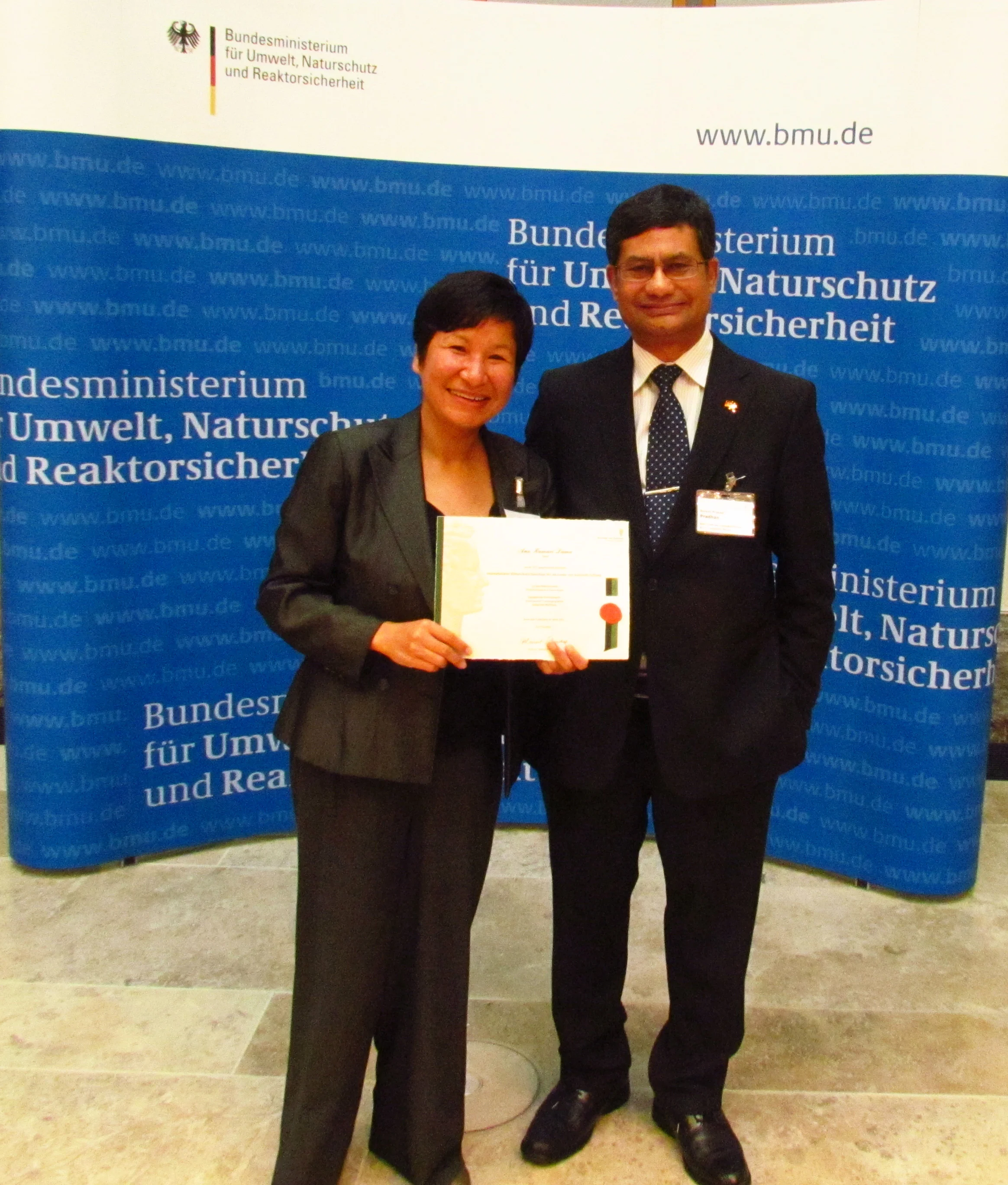 Anu, with Nepal ambassador at the German State Parliament, 2012.