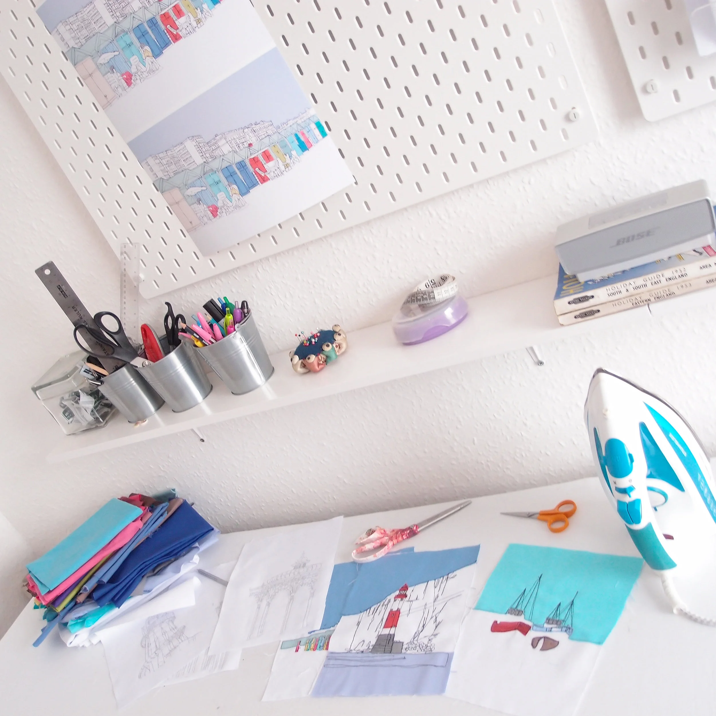 A sometimes well organised sewing table, I've lined this desk with felt and a cotton top so I can iron directly onto the table top.