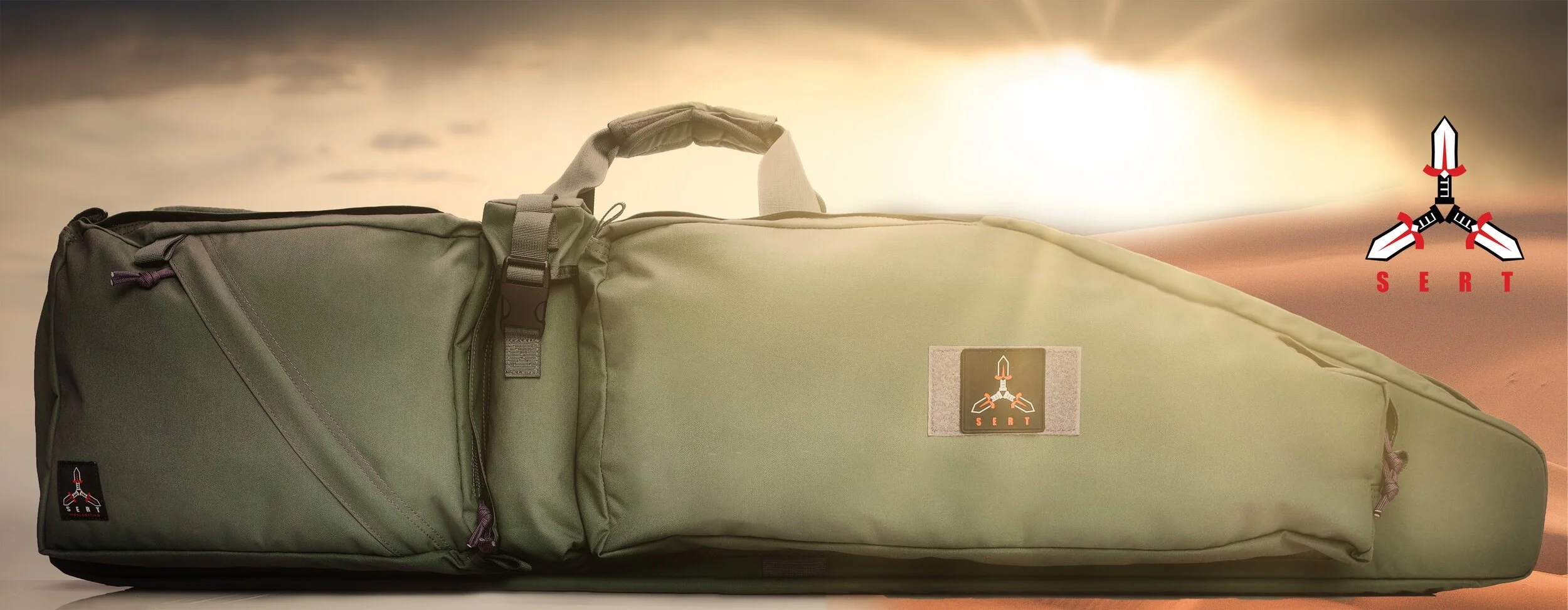 A green tent bag with a handle and multiple zippers, branding labels, set against a background of desert and a sunset or sunrise sky, with a logo of three knives arranged in a triangle with red accents and the word "SERT" underneath.
