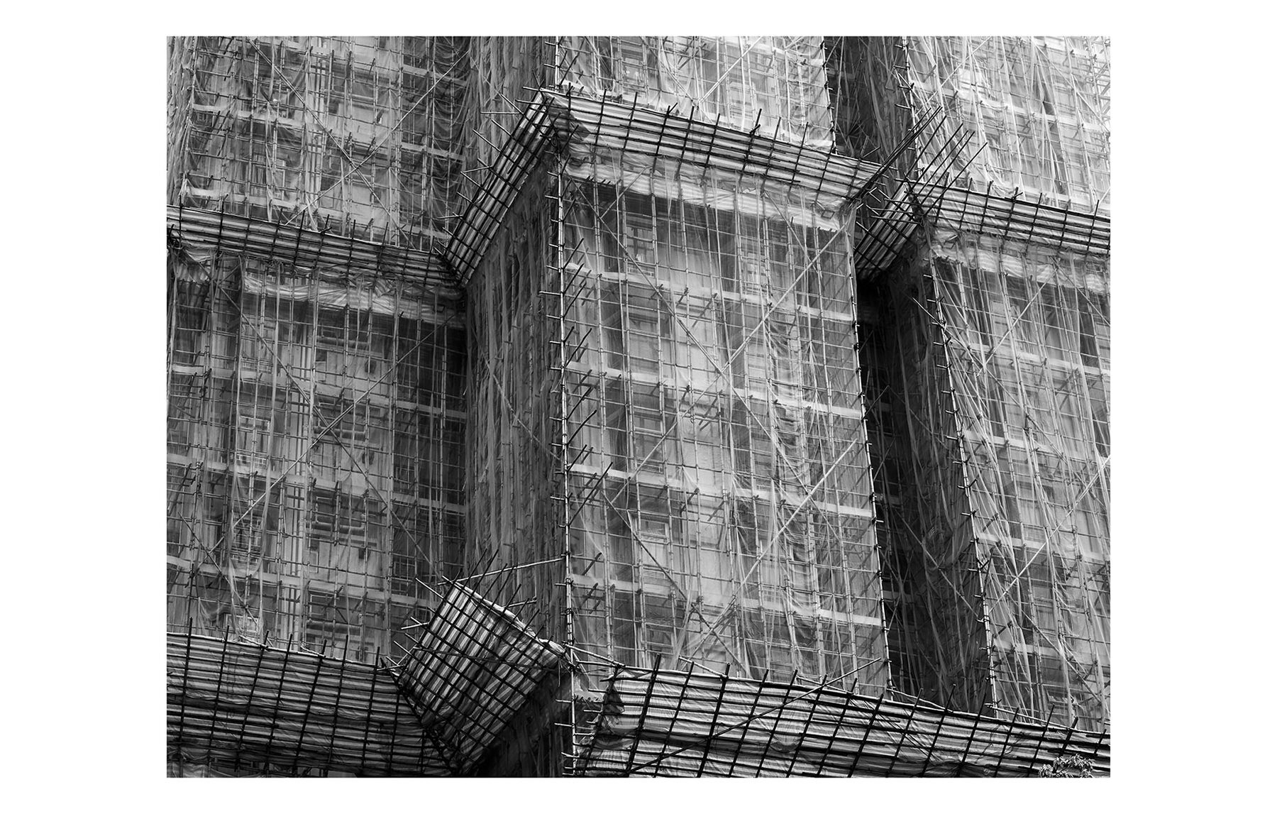  The Horse Latitudes  Construction.  Hong Kong      Detail of bamboo scaffold which covers some of the most modern buildings in Hong Kong,   Traditional methods    