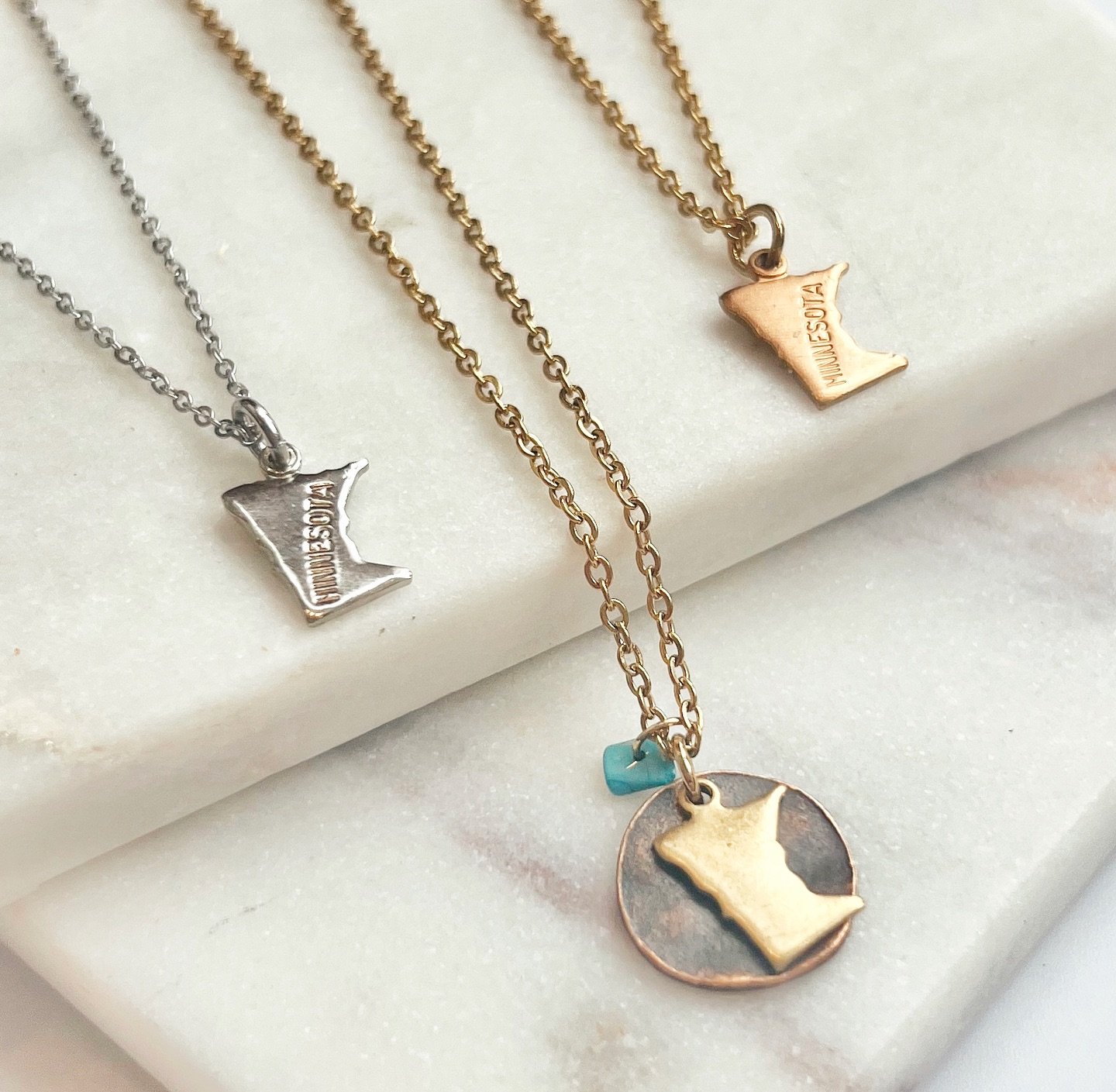 Are you celebrating a special graduate this weekend? I want them to have the perfect gift to remember their time in Minnesota?

We have the perfect gift, small enough to take anywhere and cute enough to wear every day!

Our dainty Minnesota necklace 