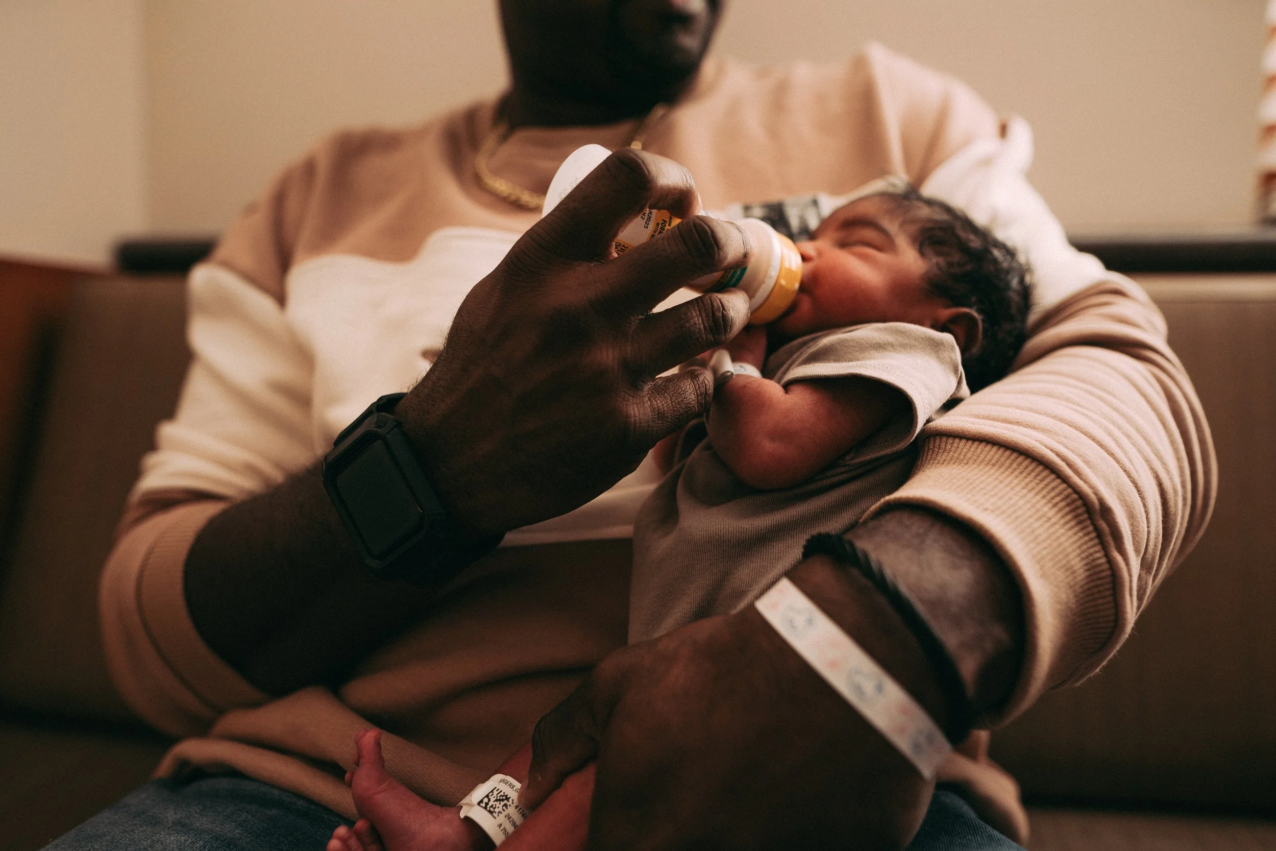 New father feeding his newborn baby at Northside Atlanta Hospital