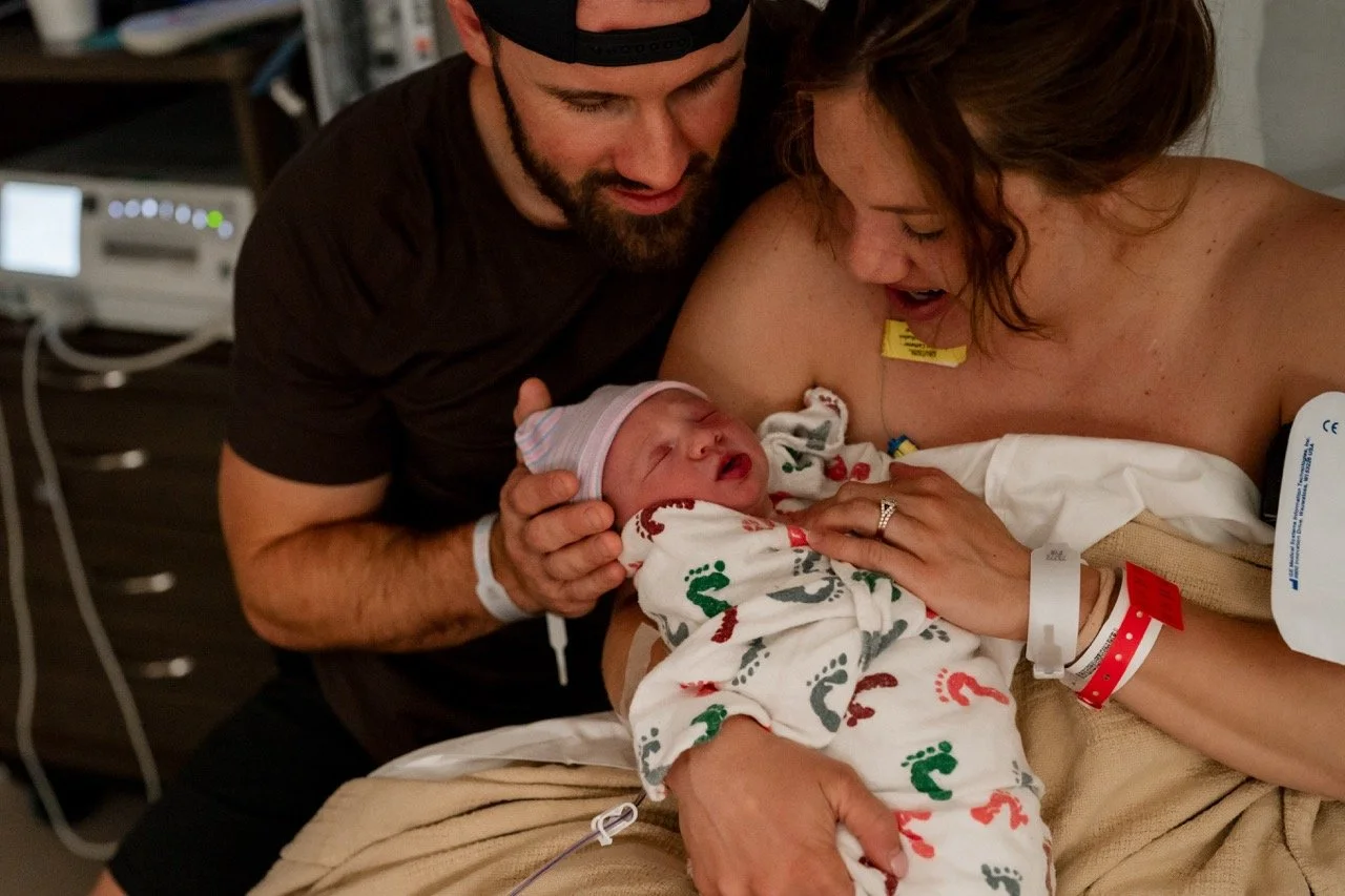 Parents snuggling their newborn baby at Piedmont Hospital Atlanta