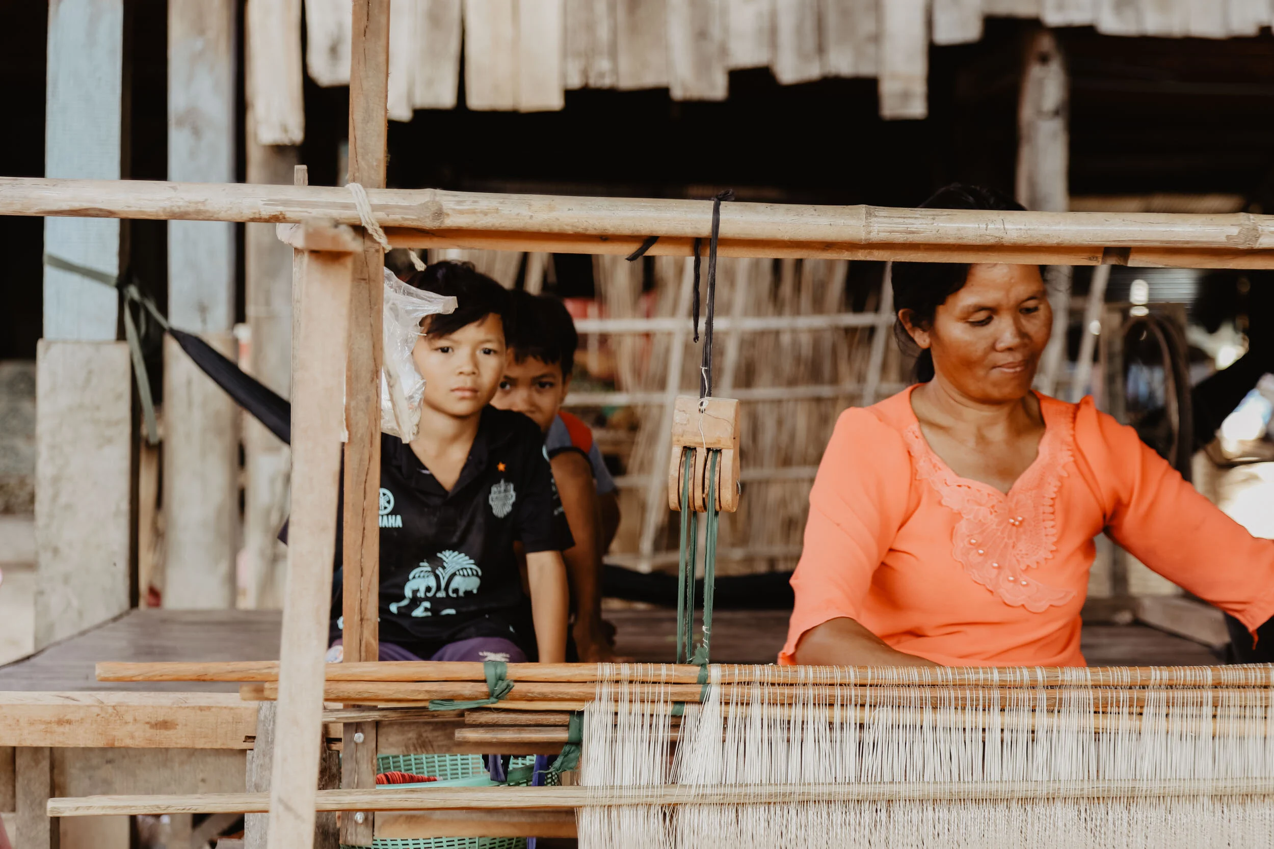 artisan weaving on loom in cambodia