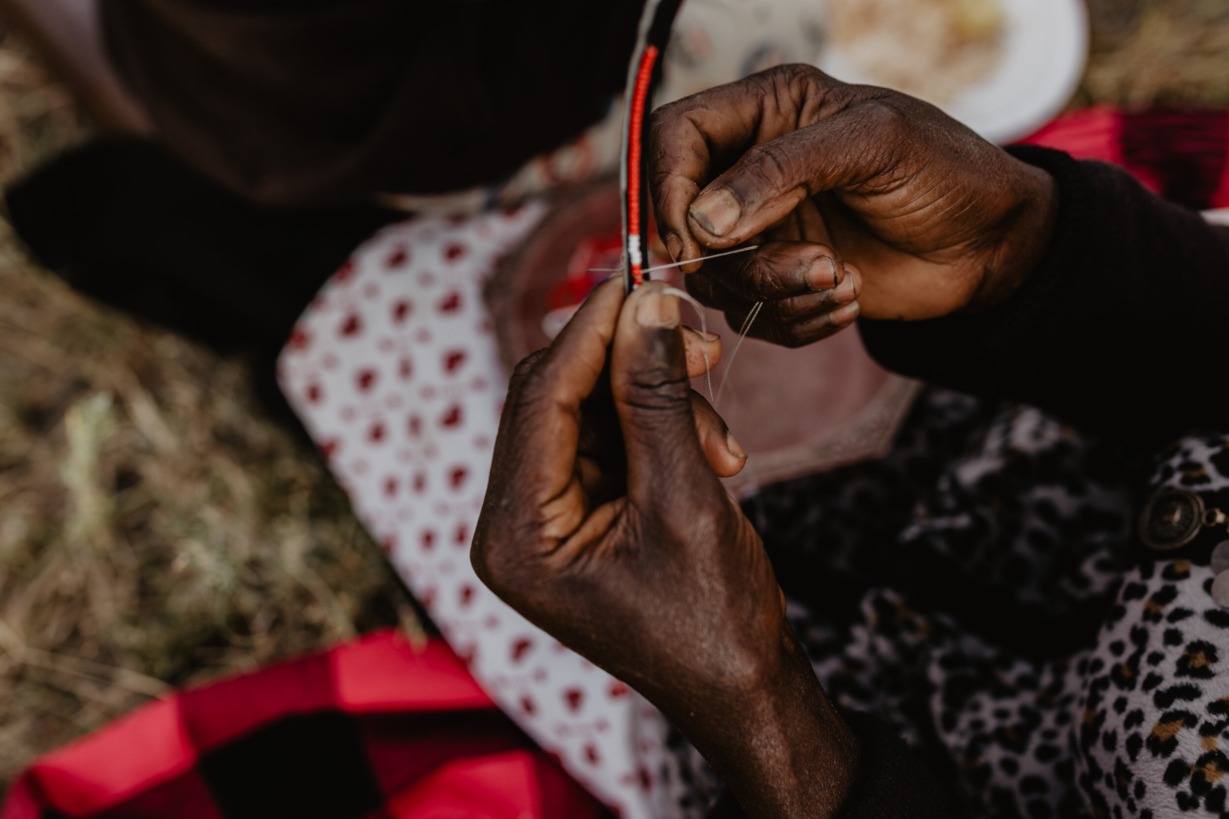 hand beading a bracelet