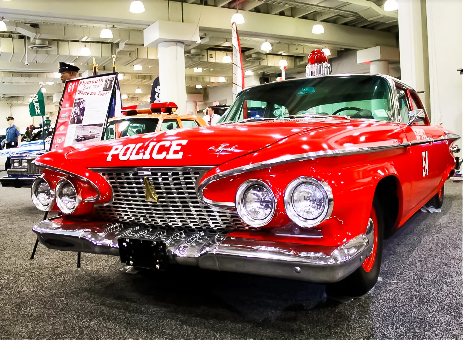 1961 PLYMOUTH SAVOY – The car was given a bright red paint job specifically to avoid any confusion with a real NYPD patrol car.