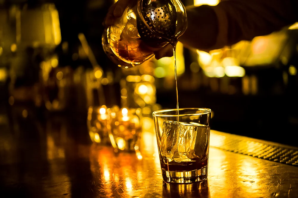 PDT in New York City is known for its innovative and unexpected cocktails. One of its most famous drinks is the Benton's Old Fashioned.