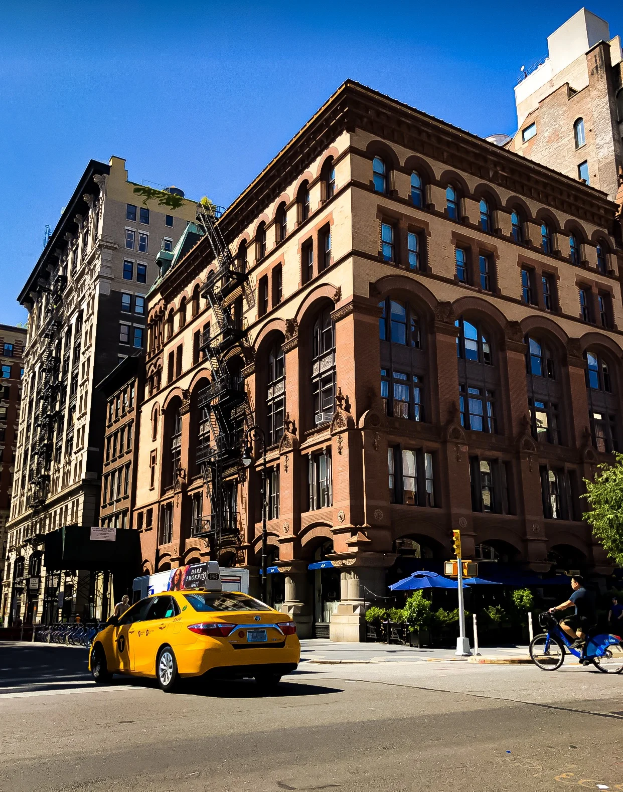 noho (north of houston street) surrounded by blue sky and sun. photo @lucascompan