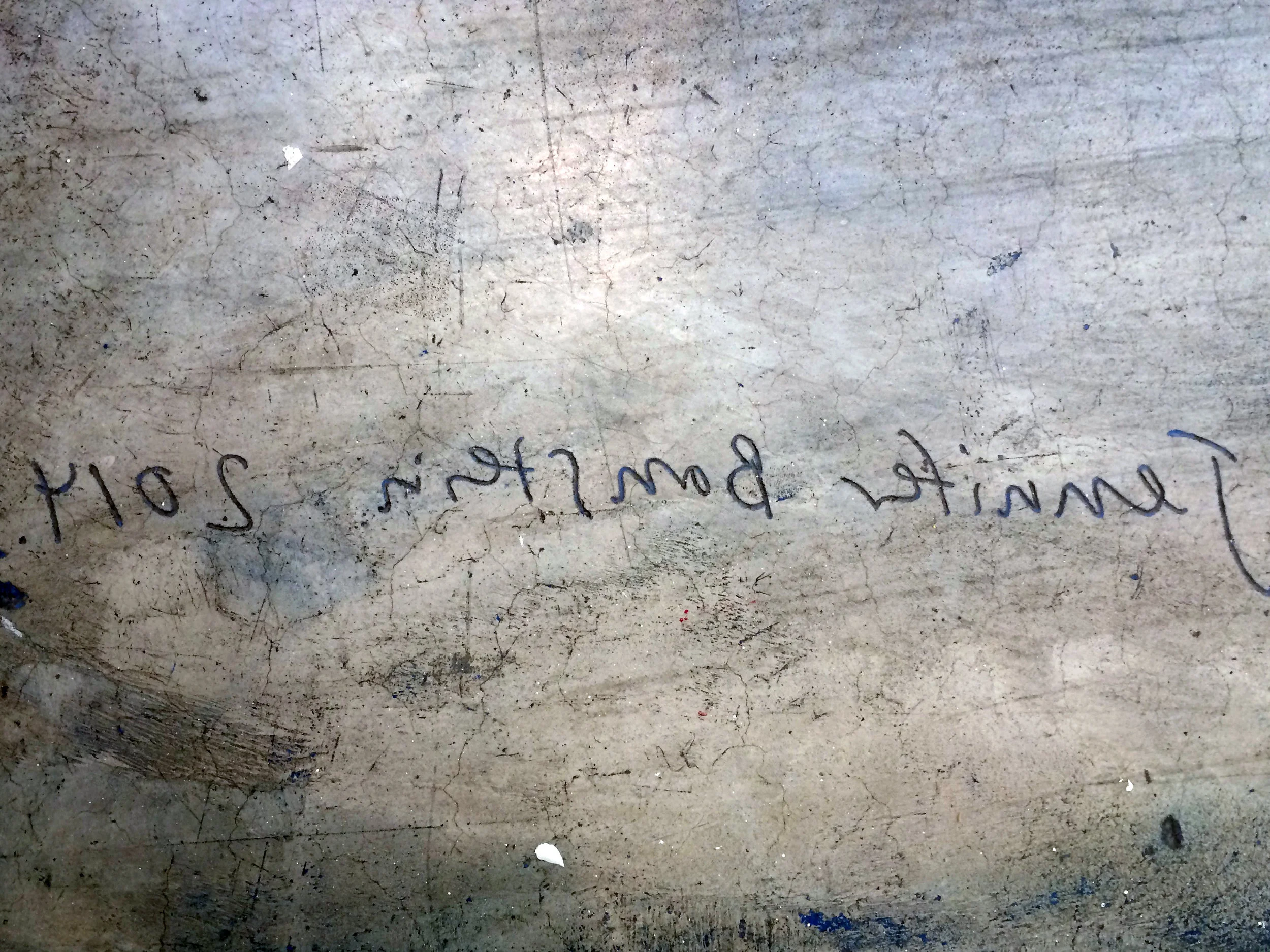 Artist Jennifer Bornstein's signature engraved in the concrete gallery floor at Gavin Brown's Enterprise for her monoprint Floor 1 2014